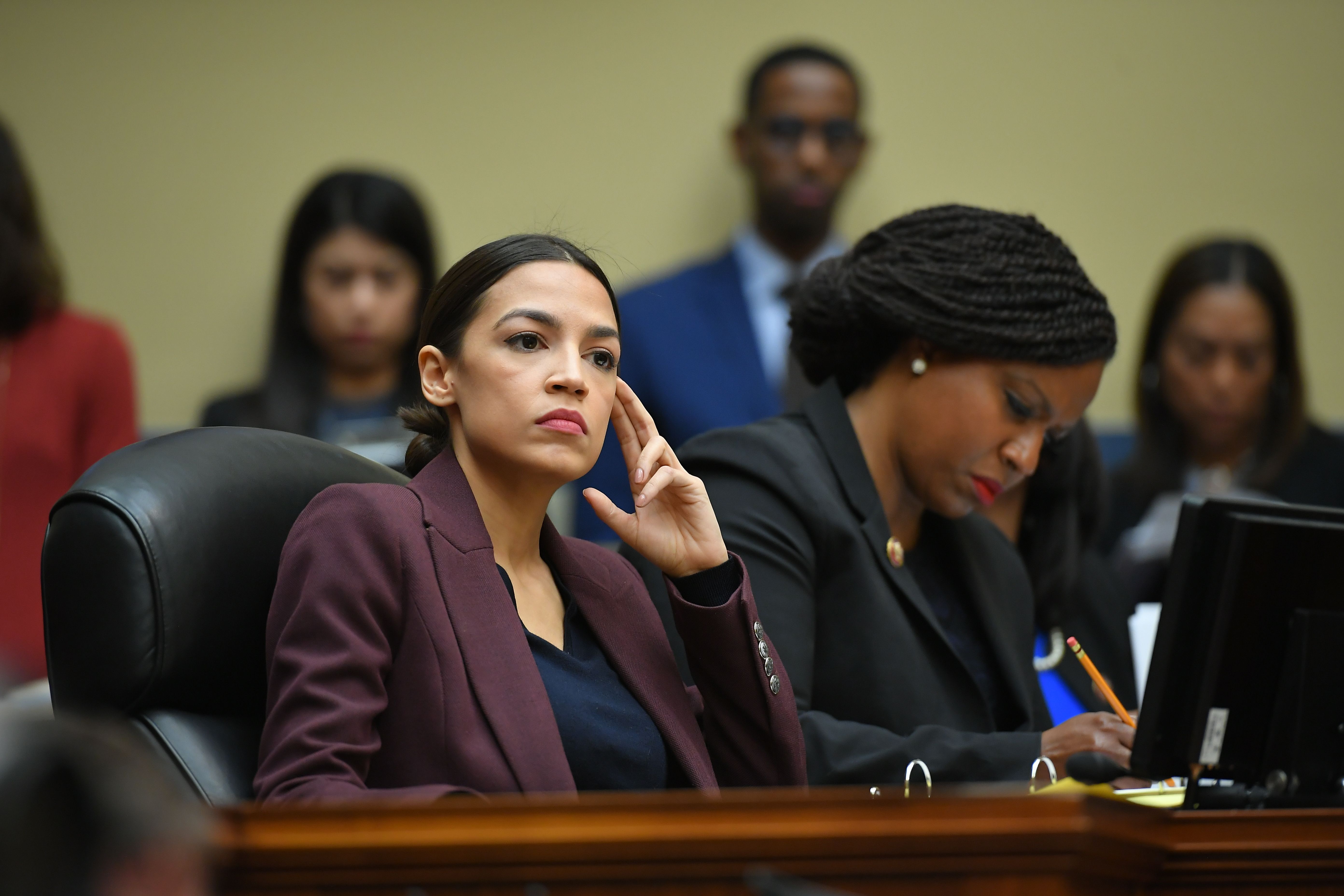 US Congresswoman Alexandria Ocasio-Cortez(D-NY) listens as Michael Cohen, attorney for President Trump, testifies before the House Oversight and Reform Committee in the Rayburn House Office Building on Capitol Hill in Washington, DC on February 27, 2019. (MANDEL NGAN/AFP/Getty Images)