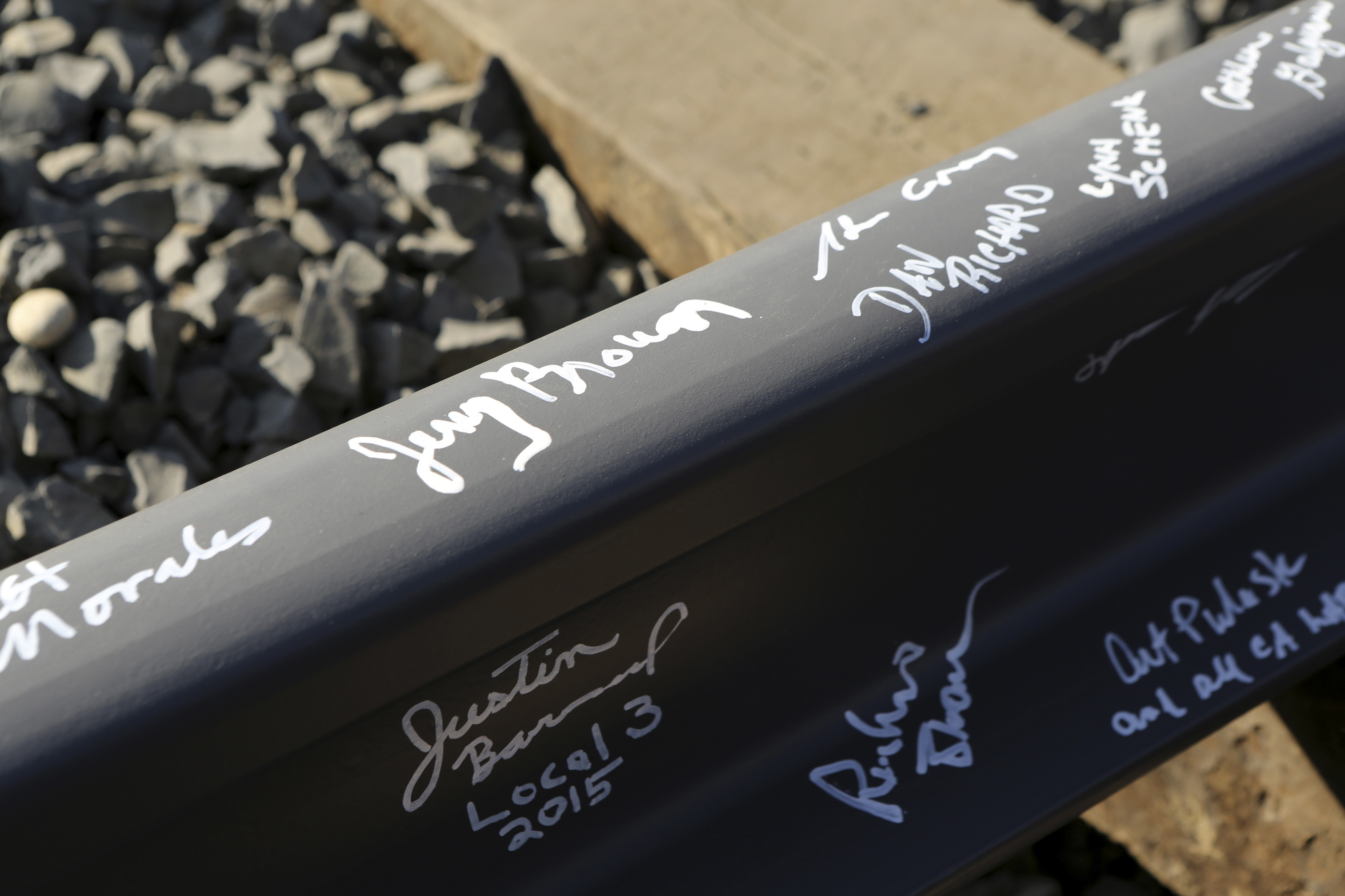California Governor Brown's name and others are pictured on a railroad rail after a ceremony for the California High Speed Rail in Fresno