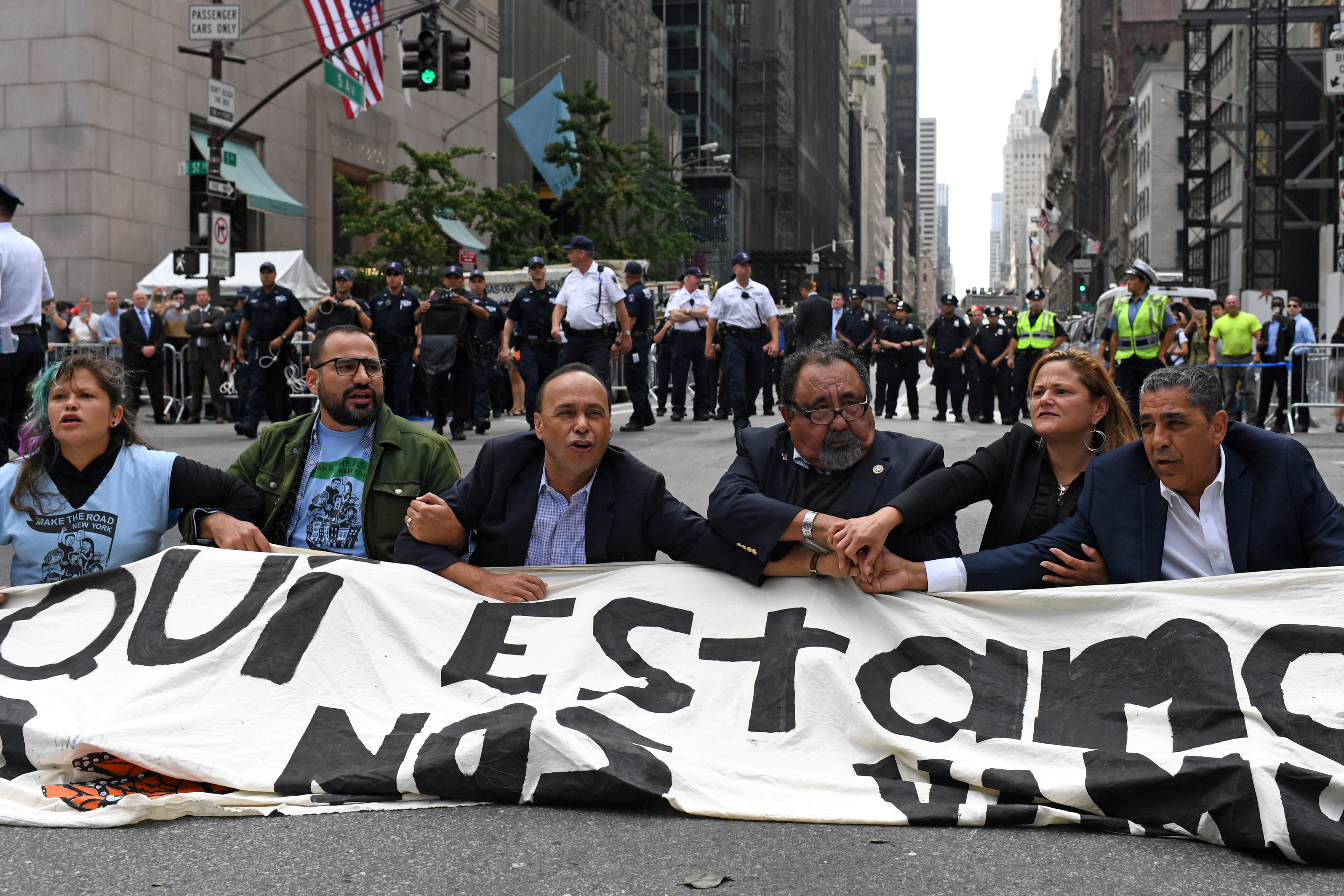 Congressman Espaillat, Speaker of the New York City Council Mark-Viverito, Congressman Grijalva and Congressman Gutierrez sit on 5th Avenue during a rally to demand that President Trump works with Congress to pass a clean DREAM Act in New York