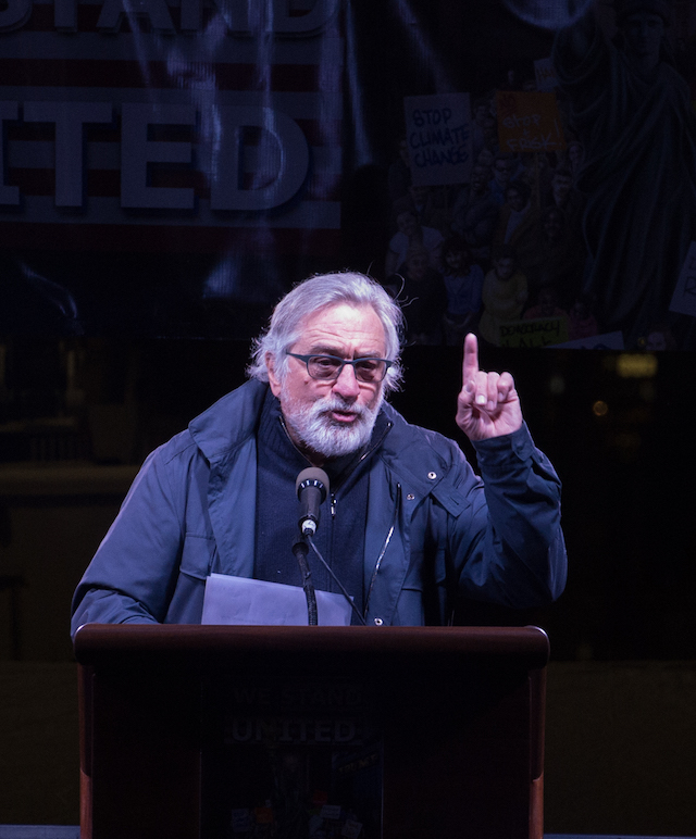 Robert De Niro speaks at the "We Stand United" rally on the eve of U.S. President-elect Donald Trump's inauguration outside Trump International Hotel and Tower in New York on January 19, 2017 in New York. (Photo credit: BRYAN R. SMITH/AFP/Getty Images)