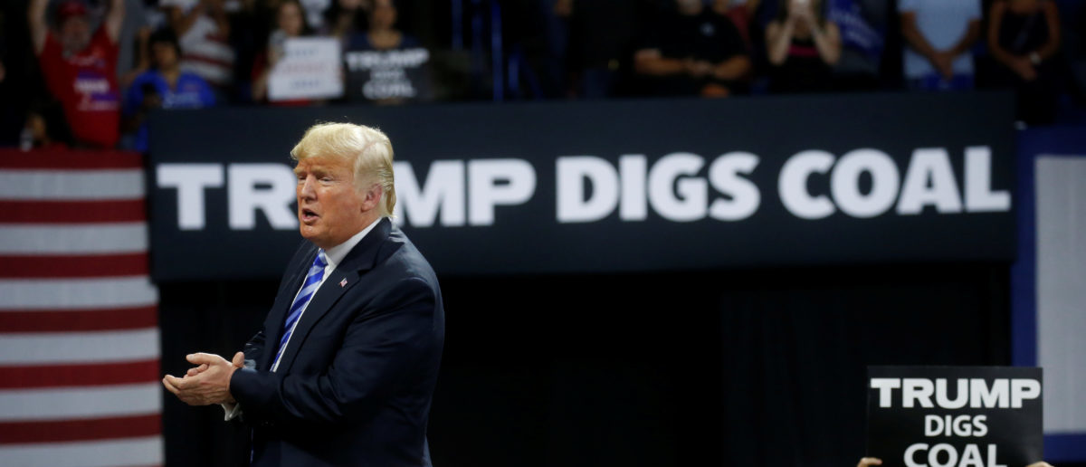 U.S. President Donald Trump acknowledges coal miners during a Make America Great Again rally at the Civic Center in Charleston, West Virginia, U.S., August 21, 2018. REUTERS/Leah Millis