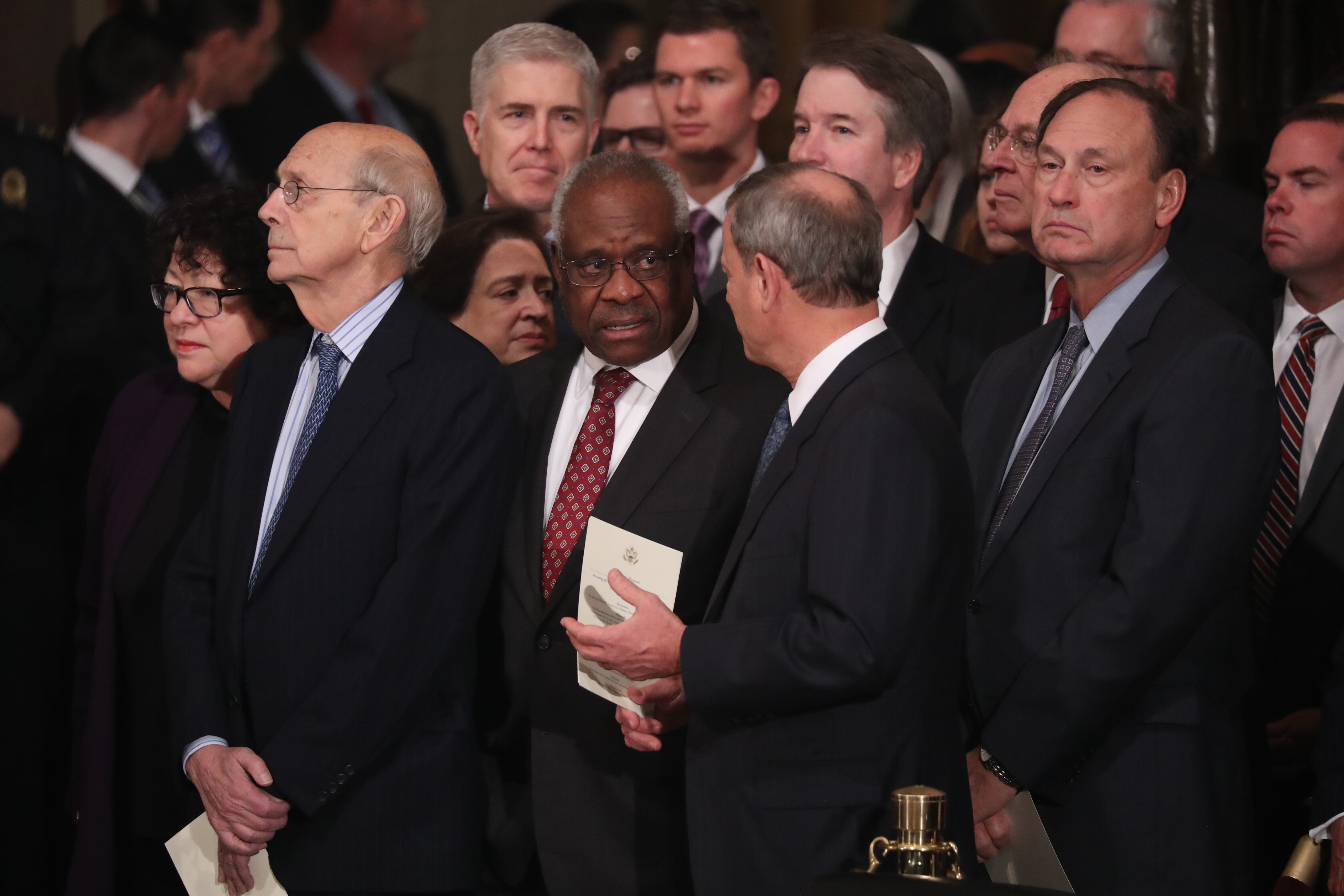 Justice Clarence Thomas, at center, awaits the arrival of former President George H.W. Bush's casket at the Capitol Rotunda on December 3, 2018 (Jonathan Ernst/Getty Images)