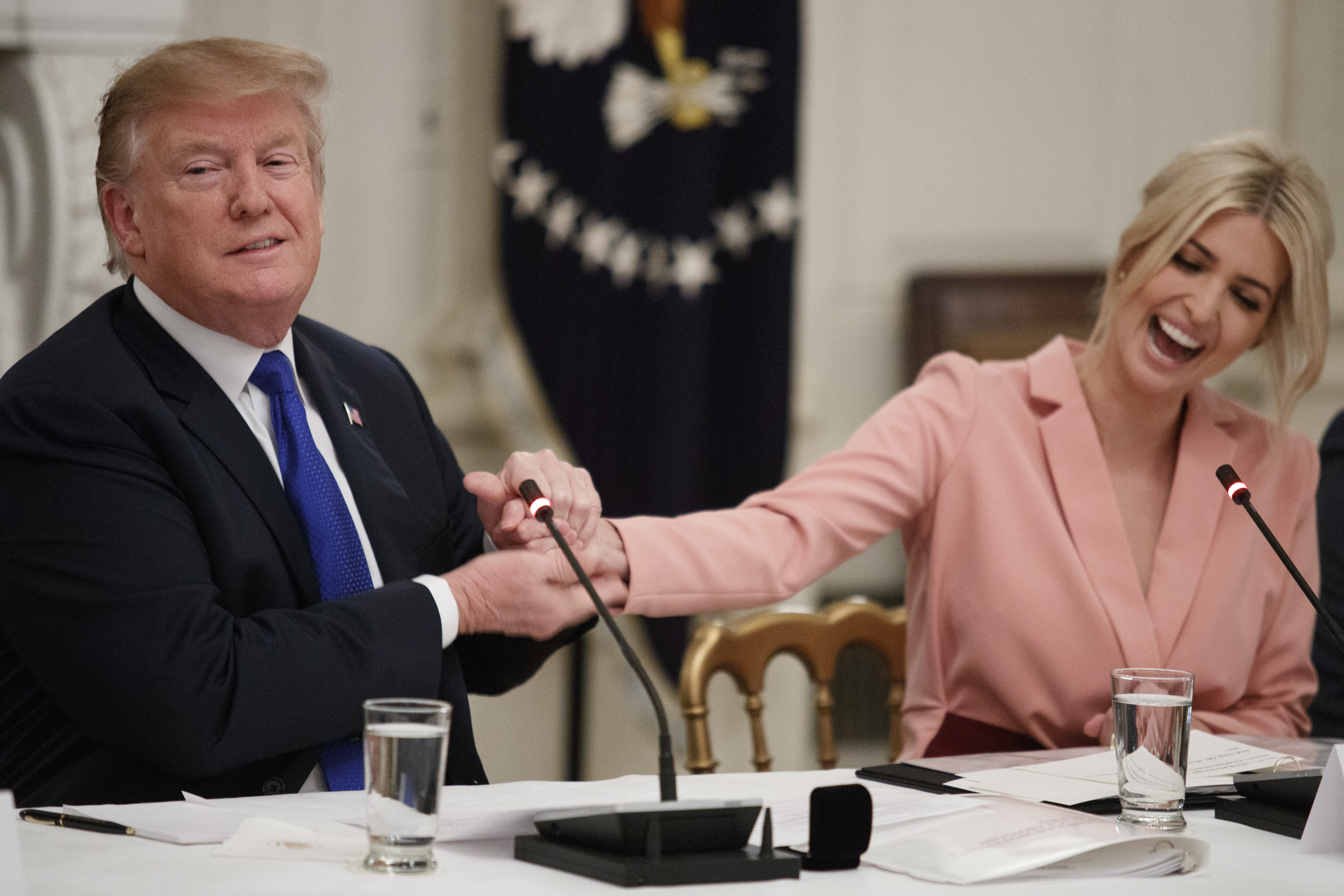 WASHINGTON, DC - MARCH 06: President Donald Trump shakes the had of his daughter and advisor, Ivanka Trump during a meeting with the American Workforce Policy Advisory Board inside the State Dining Room of the White House on March 6, 2019 in Washington, DC. The board, co-chaired by Ivanka and Commerce Secretary Wilbur Ross, is tasked with developing a strategy to revamp the U.S. workforce for well-paid, in-demand jobs and with promoting private-sector investments in workers. (Photo by Tom Brenner/Getty Images)