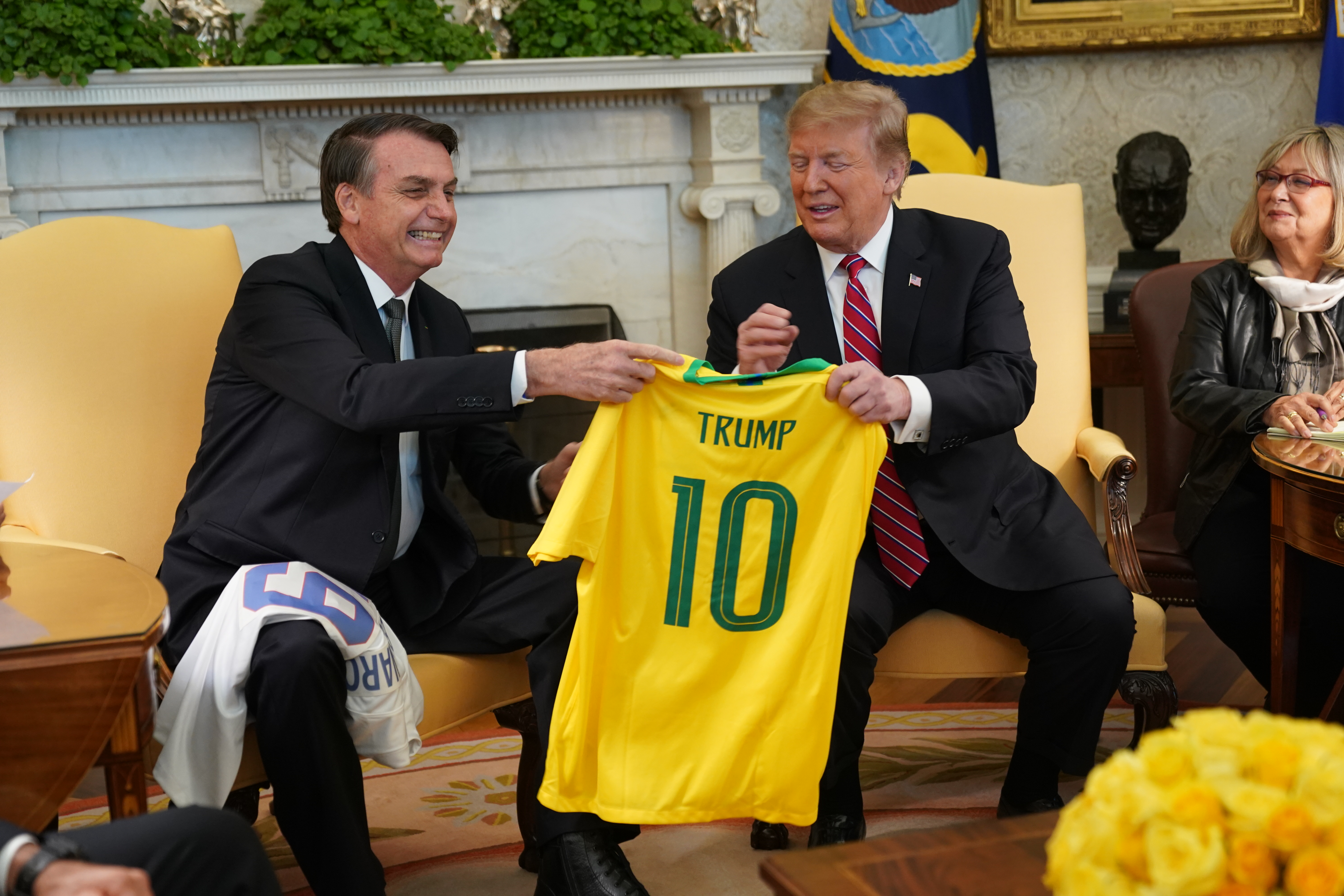 Brazilian President Jair Bolsonaro presents U.S. President Donald Trump with a Brazil national soccer team jersey Number 10 for striker position at the White House March 19, 2019 in Washington, DC. (Photo by Chris Kleponis-Pool/Getty Images)