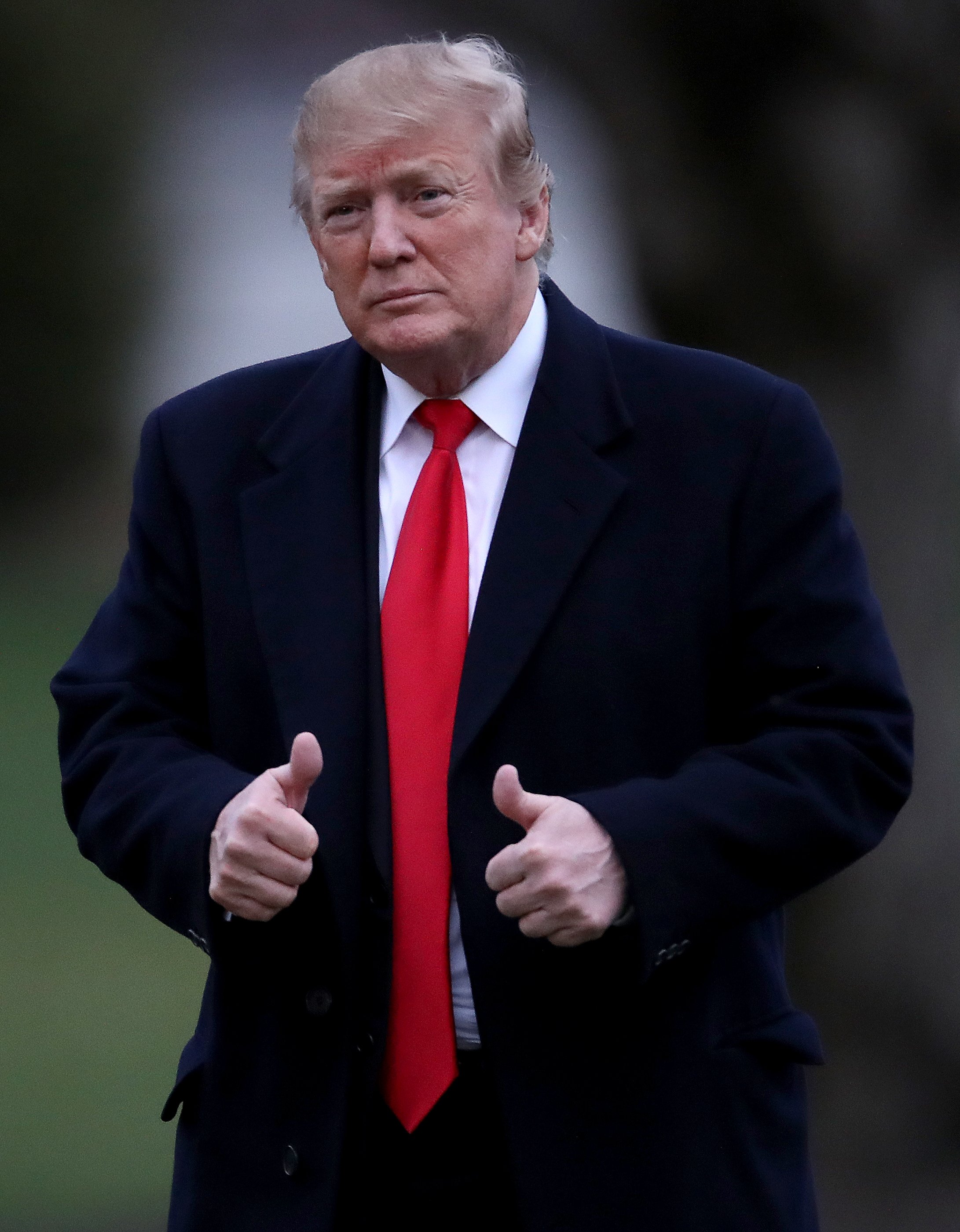 U.S. President Donald Trump gives a thumbs up sign to supporters who applauded as he returned to the White House after spending the weekend in Florida March 24, 2019 in Washington, DC. (Photo by Win McNamee/Getty Images)