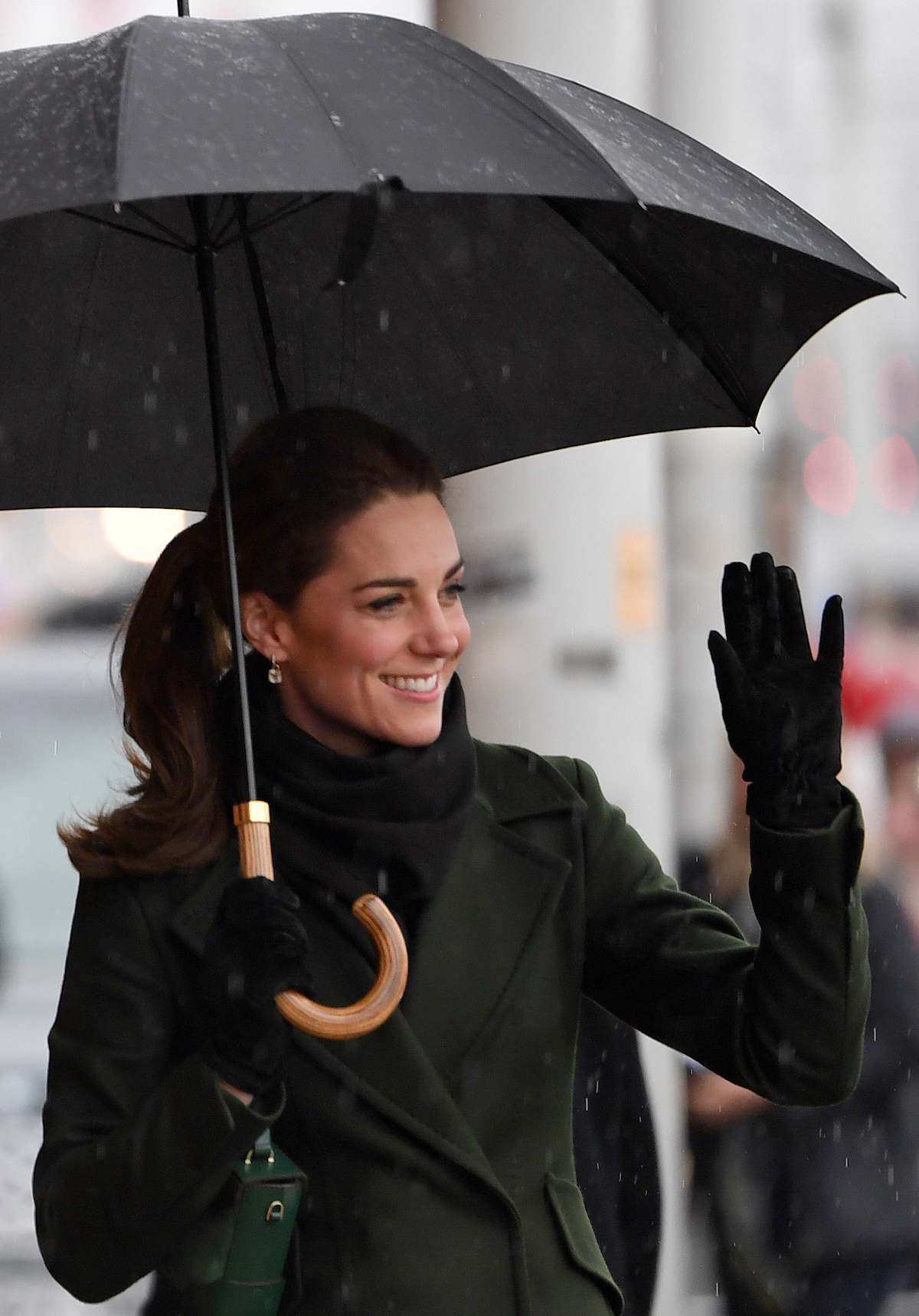 Britain's Catherine, Duchess of Cambridge shelters from the rain beneath an umbrella as she arrives to visit Blackpool Tower in Blackpool, north-west England on March 6, 2019. (Photo credit: PAUL ELLIS/AFP/Getty Images)