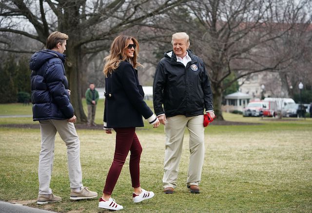 US President Donald Trump is joined by First Lady Melania Trump and their son Barron before boarding Marine One to depart from the South Lawn of the White House on March 8, 2019 in Washington, DC. - Trump is heading to Alabama to survey tornado damage before spending the weekend at his Mar-a-Lago resort in Florida. (Photo credit: MANDEL NGAN/AFP/Getty Images)