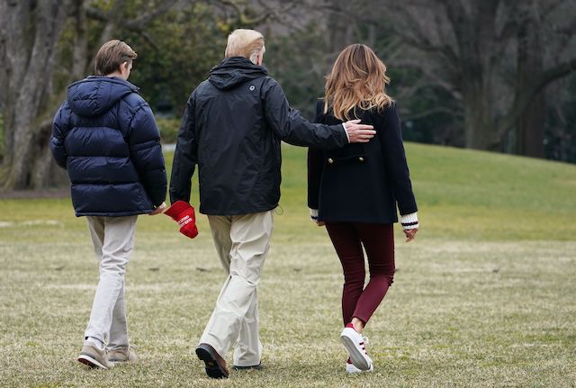 US President Donald Trump (C) is joined by First Lady Melania Trump (R) and their son Barron before boarding Marine One to depart from the South Lawn of the White House on March 8, 2019 in Washington, DC. - Trump is heading to Alabama to survey tornado damage before spending the weekend at his Mar-a-Lago resort in Florida. (Photo credit: MANDEL NGAN/AFP/Getty Images)