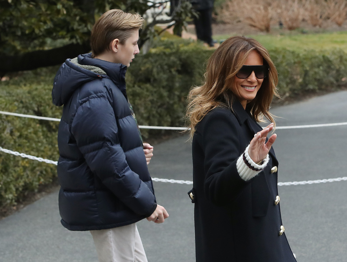 First Lady Melania Trump walks with her son Barron Trump as they depart with U.S. President Donald Trump, from the South Lawn of the White House on March 8, 2019 in Washington, DC. President Trump is headed to Alabama to survey tornado damage. (Photo by Mark Wilson/Getty Images)