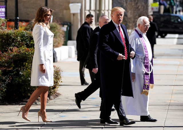 U.S. President Donald Trump and U.S. first lady Melania Trump walk with Interim Rector Reverend Bruce McPherson as they depart from St. John's Episcopal Church in Washington, U.S., March 17, 2019. REUTERS/Joshua Roberts