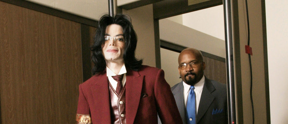 Michael Jackson passes through security as he arrives for his child molestation trial at the Santa Barbara County Courthouse April 27, 2005 in Santa Maria, California. Jackson is charged in a 10-count indictment with molesting a boy, plying him with liquor and conspiring to commit child abduction, false imprisonment and extortion. (Photo by Eric Neitze-PoolGetty Images)