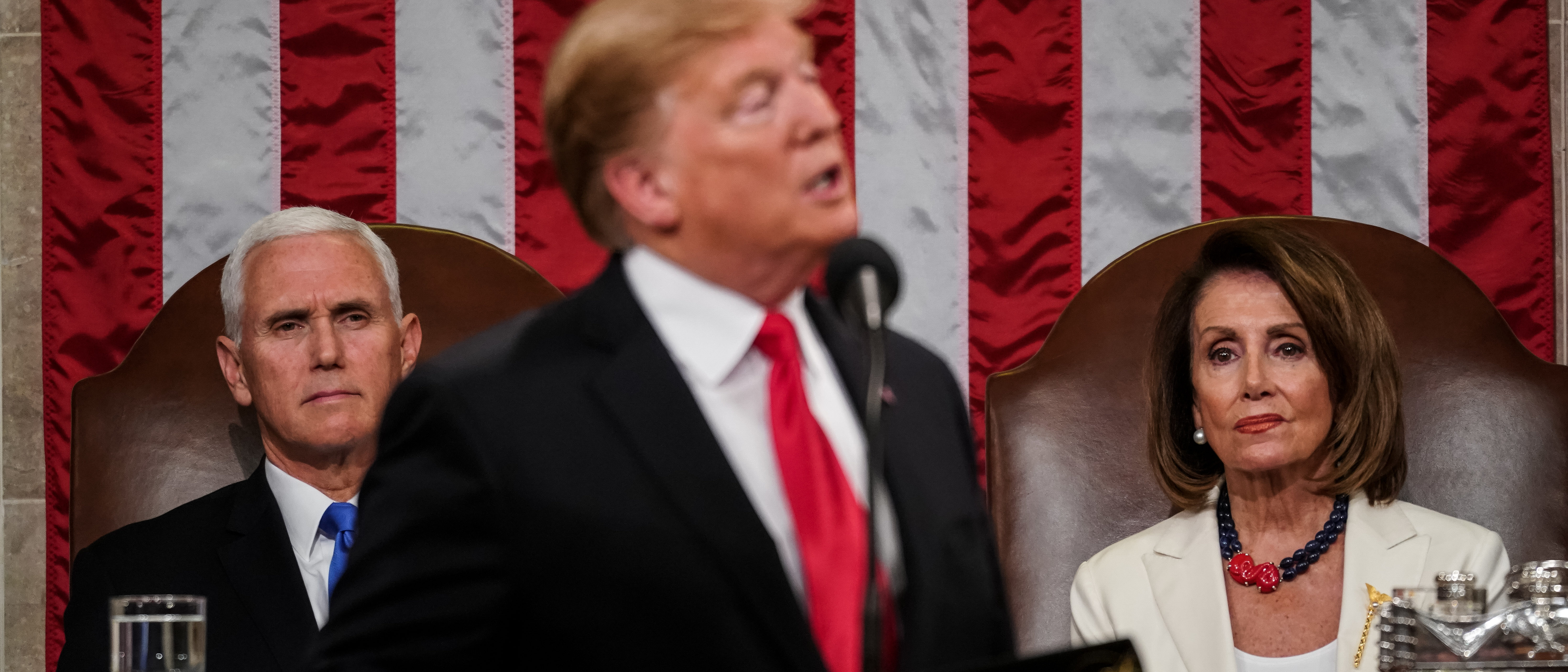 WASHINGTON, DC - FEBRUARY 5: Speaker Nancy Pelosi and Vice President Mike Pence look on as U.S. President Donald Trump delivers the State of the Union address in the chamber of the U.S. House of Representatives at the U.S. Capitol Building on February 5, 2019 in Washington, DC. (Photo by Doug Mills-Pool/Getty Images)