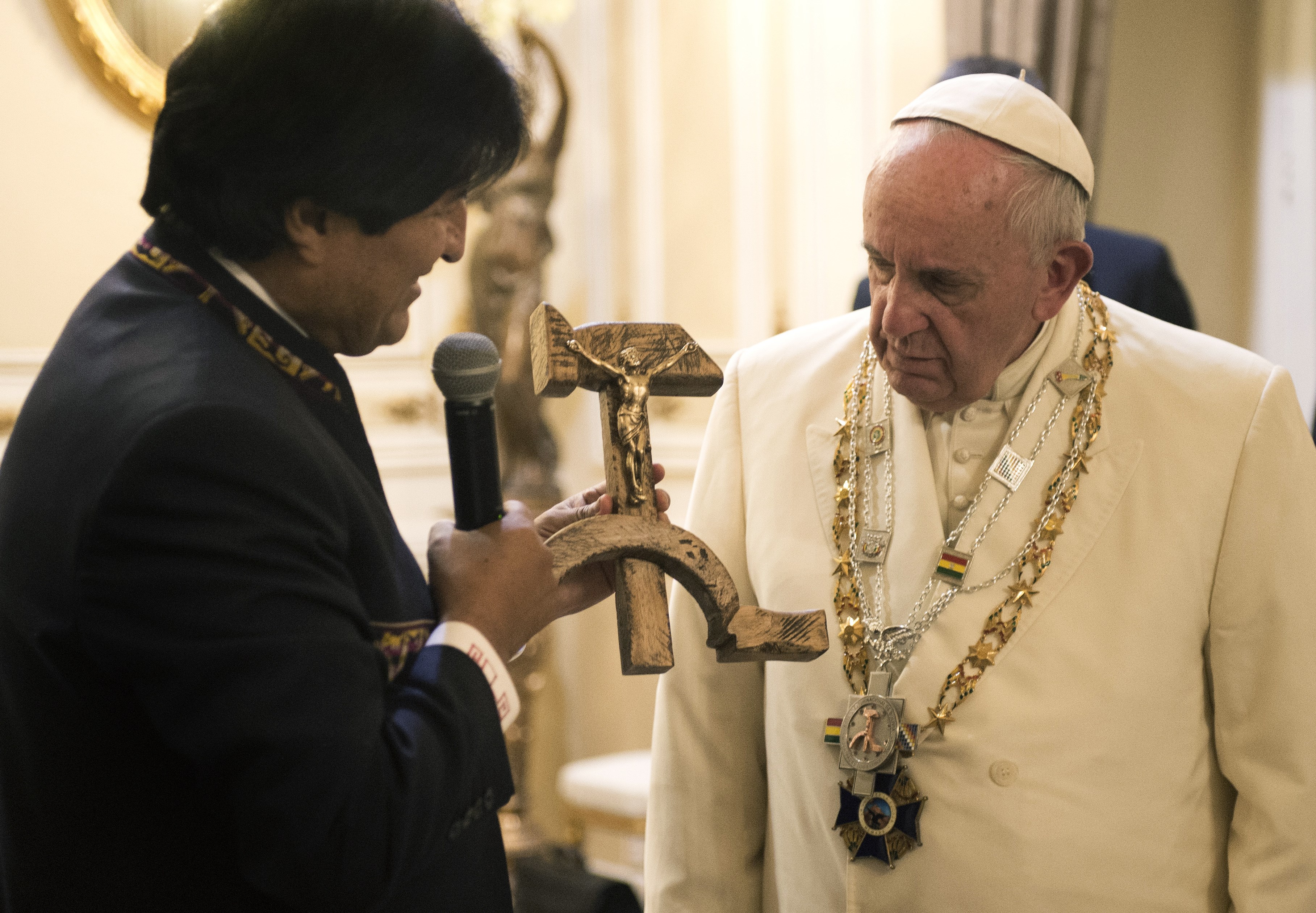 This handout picture released by the Vatican press office on July 8, 2015 shows Bolivian President Evo Morales exchanging gifts with Pope Francis in La Paz during his pastoral trip in South America. (OSSERVATORE ROMANO/AFP/Getty Images)