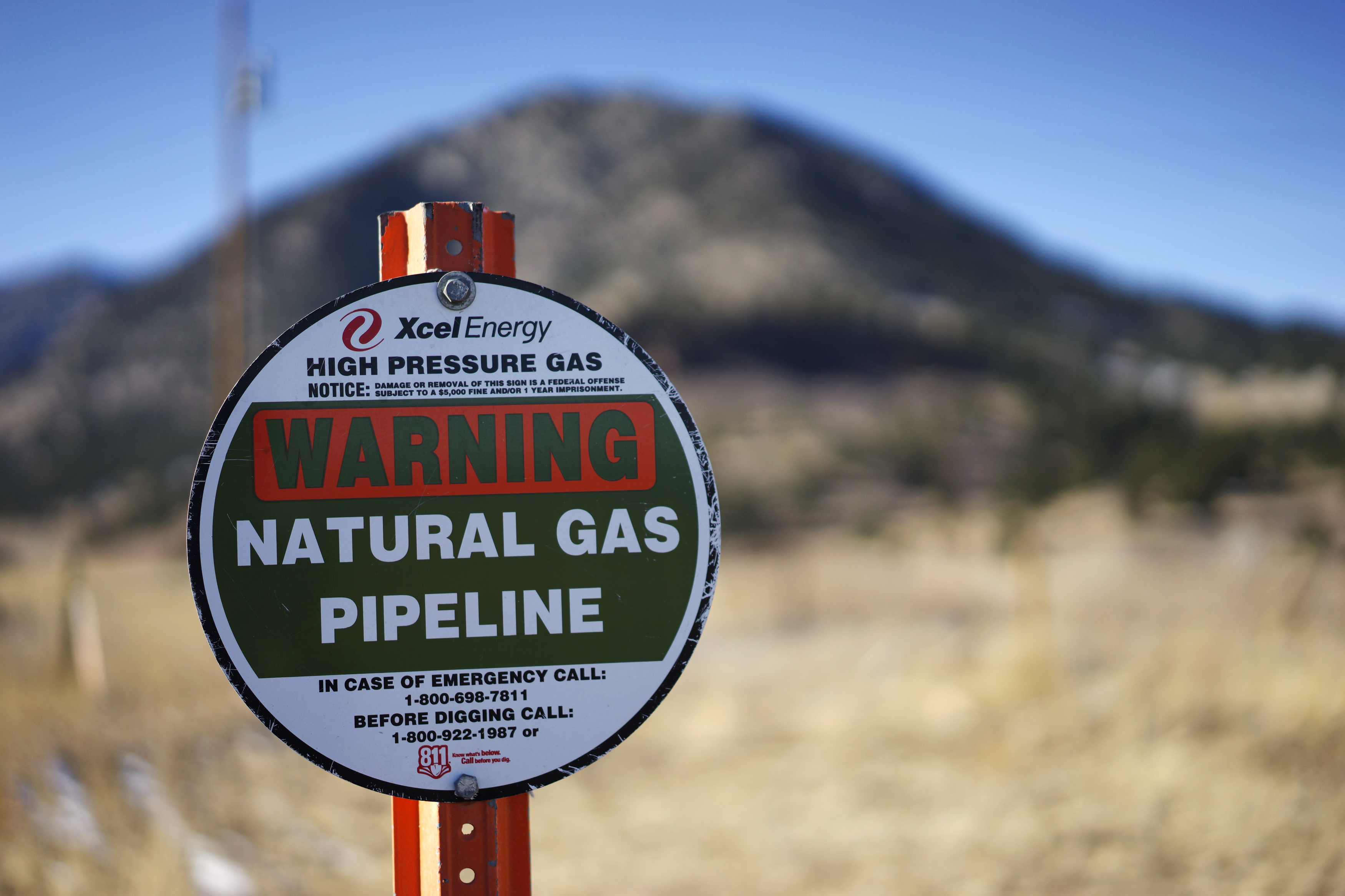 A sign marking the location of a natural gas pipeline is seen in Golden