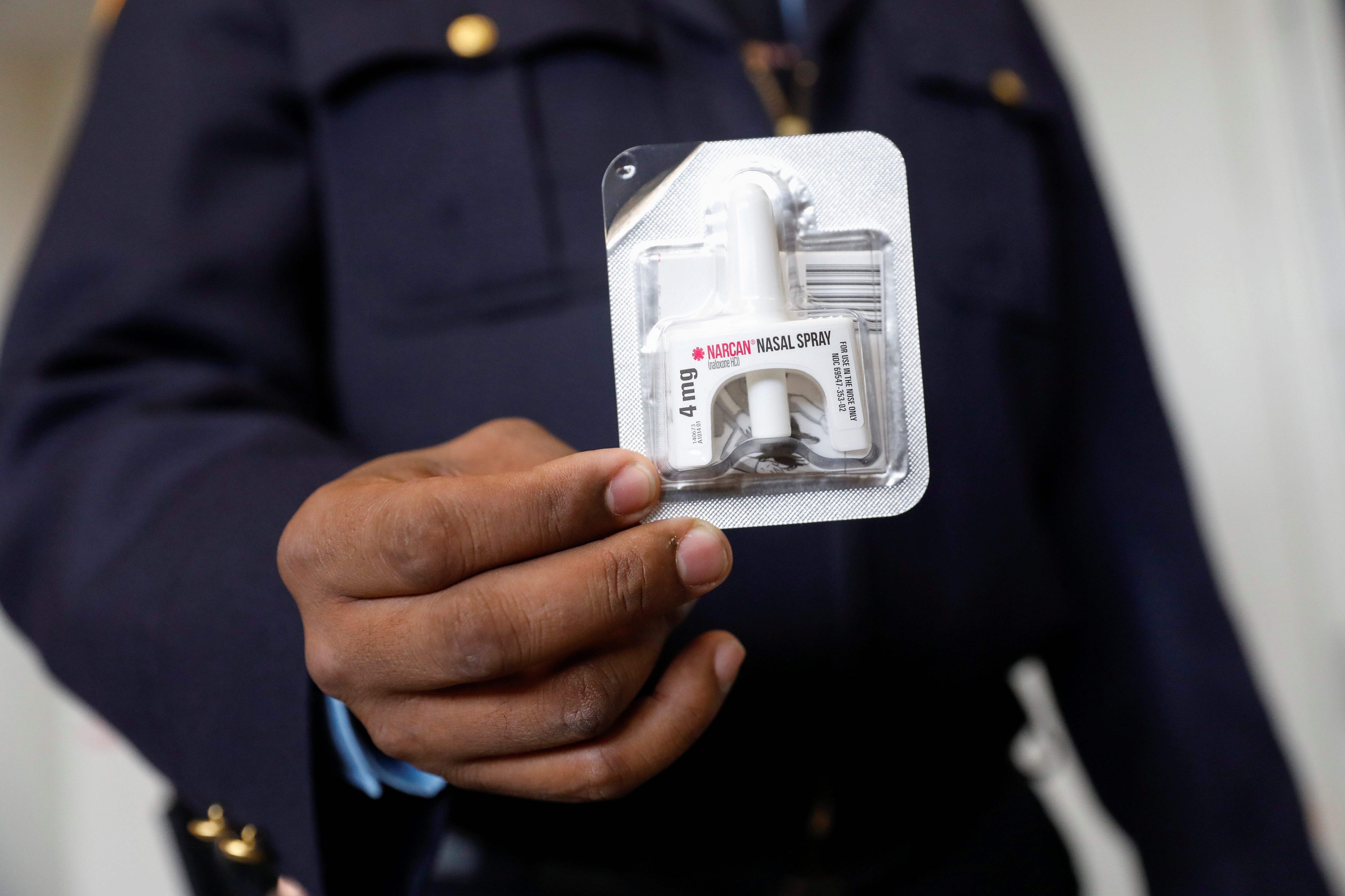 Corrections officer Anthony Willingham displays Naloxone nasal spray, part of an opioid anti-overdose medicine kit for inmates to take with them upon release, before a training session for inmates at the Queensboro Correctional Facility in Queens, New York, U.S., April 9, 2018. Picture taken April 9, 2018. REUTERS/Shannon Stapleton