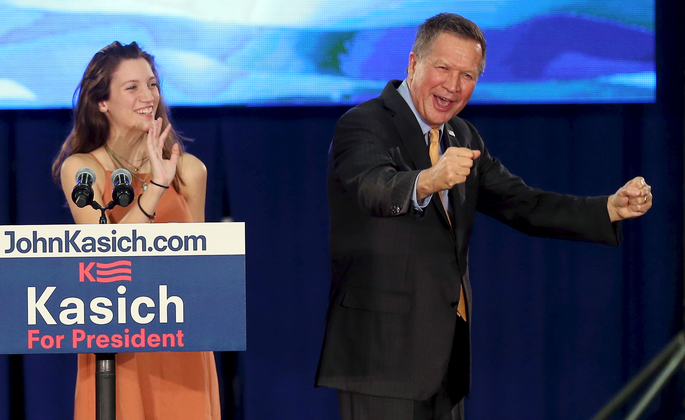 Republican U.S. presidental candidate Governor John Kasich celebrates his win in the Ohio primary election next to his daughter Rees during a campaign rally in Berea