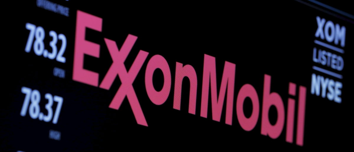 The logo of Exxon Mobil Corporation is shown on a monitor above the floor of the New York Stock Exchange in New York, New York, U.S., Dec. 30, 2015. REUTERS/Lucas Jackson