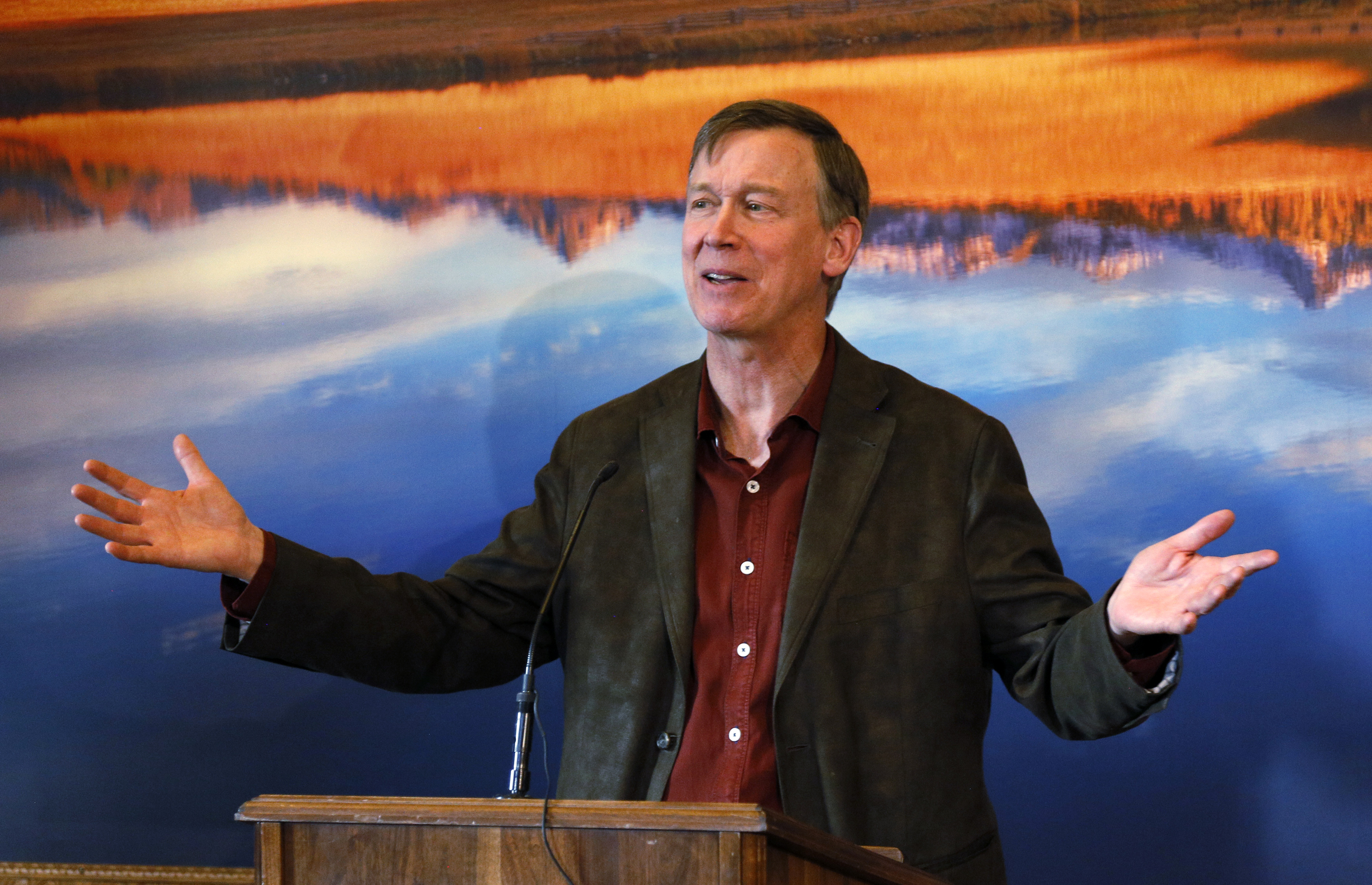 Colorado Governor John Hickenlooper lays out his plans for the next state legislative session at a news conference in his office at the Capitol in Denver