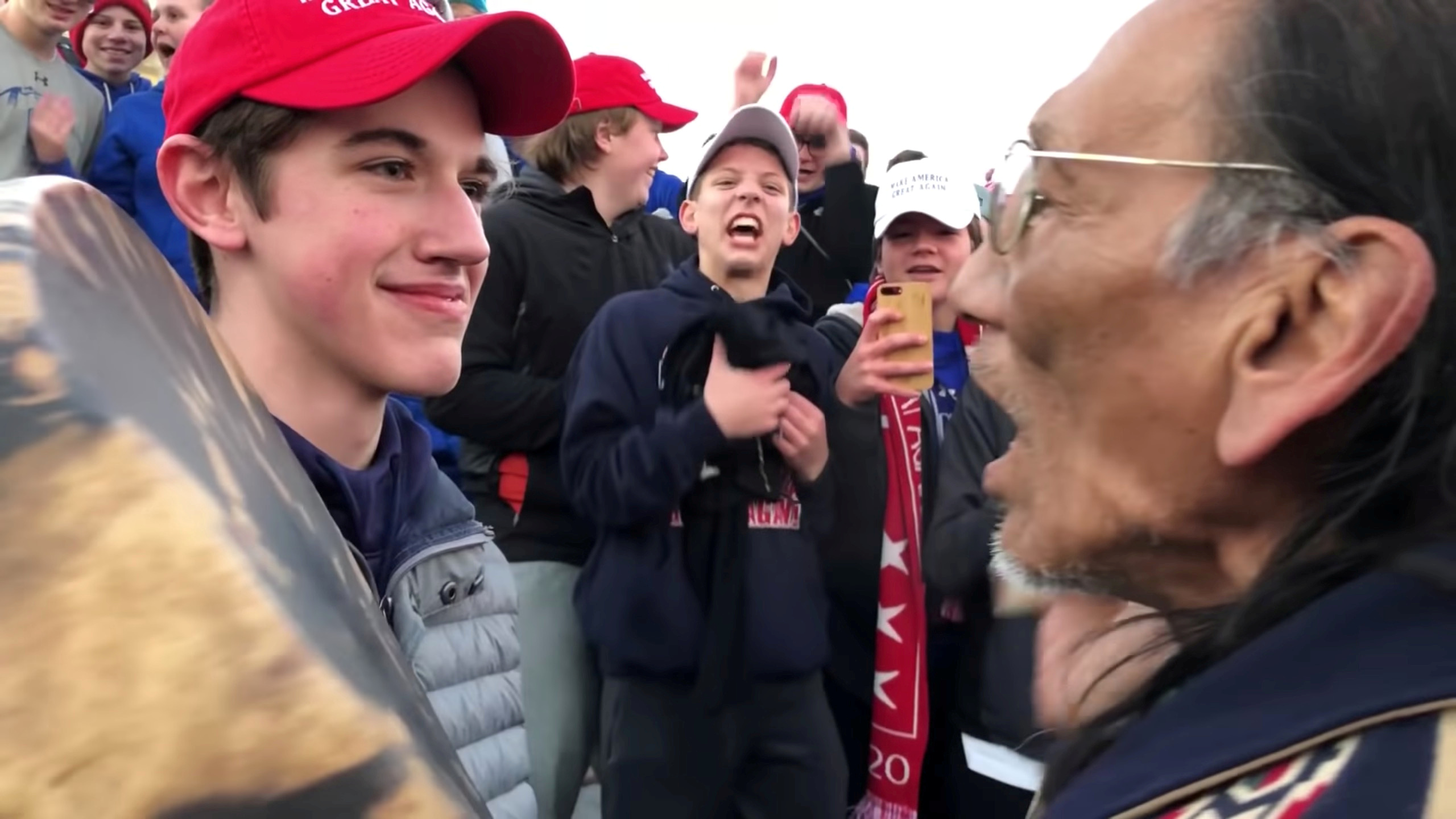 Nicholas Sandmann, 16, a student from Covington Catholic High School stands in front of Native American activist Nathan Phillips in Washington, U.S., in this still image from a January 18, 2019 video by Kaya Taitano. Kaya Taitano/Social Media/via REUTERS/File Photo