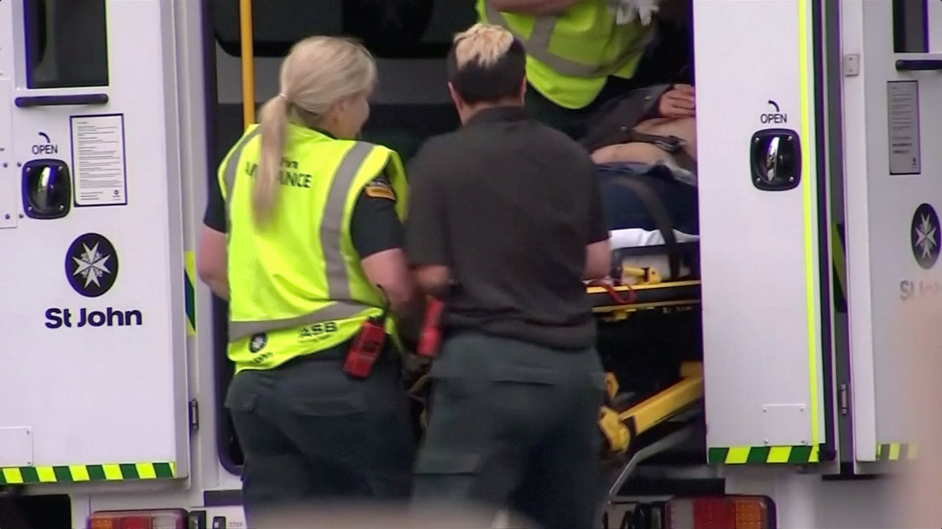 Emergency services personnel transport a stretcher carrying a person at a hospital, after reports that several shots had been fired, in central Christchurch, New Zealand March 15, 2019, in this still image taken from video. TVNZ/via REUTERS TV