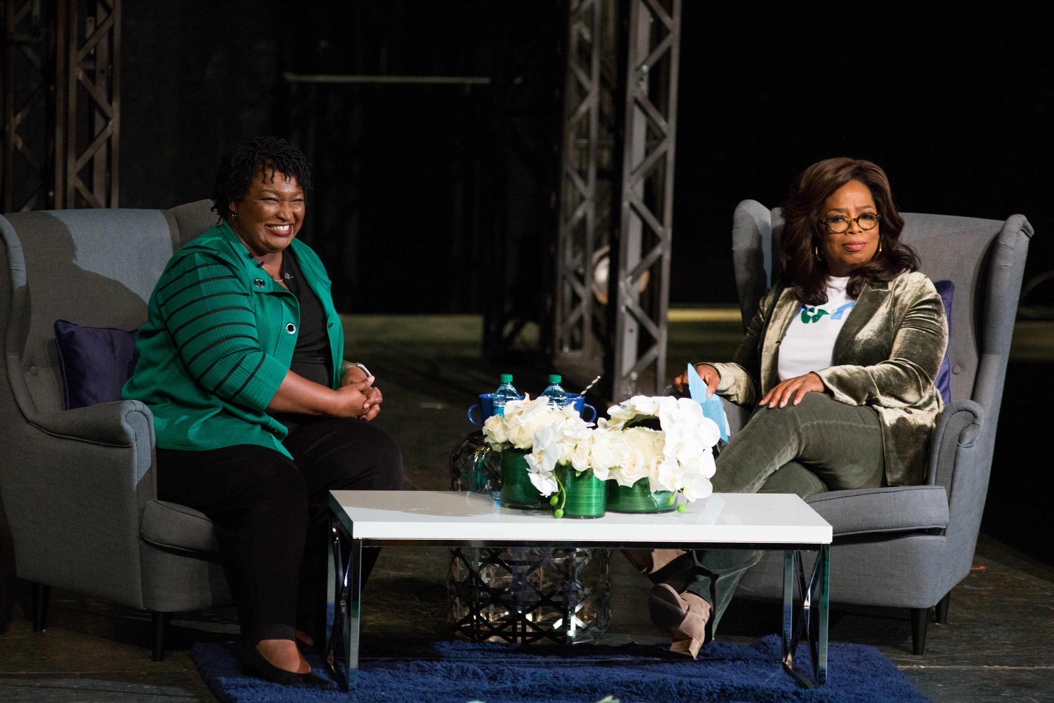 Oprah Winfrey interviews Stacey Abrams during a town hall style event at the Cobb Civic Center. (Jessica McGowan/Getty Images)