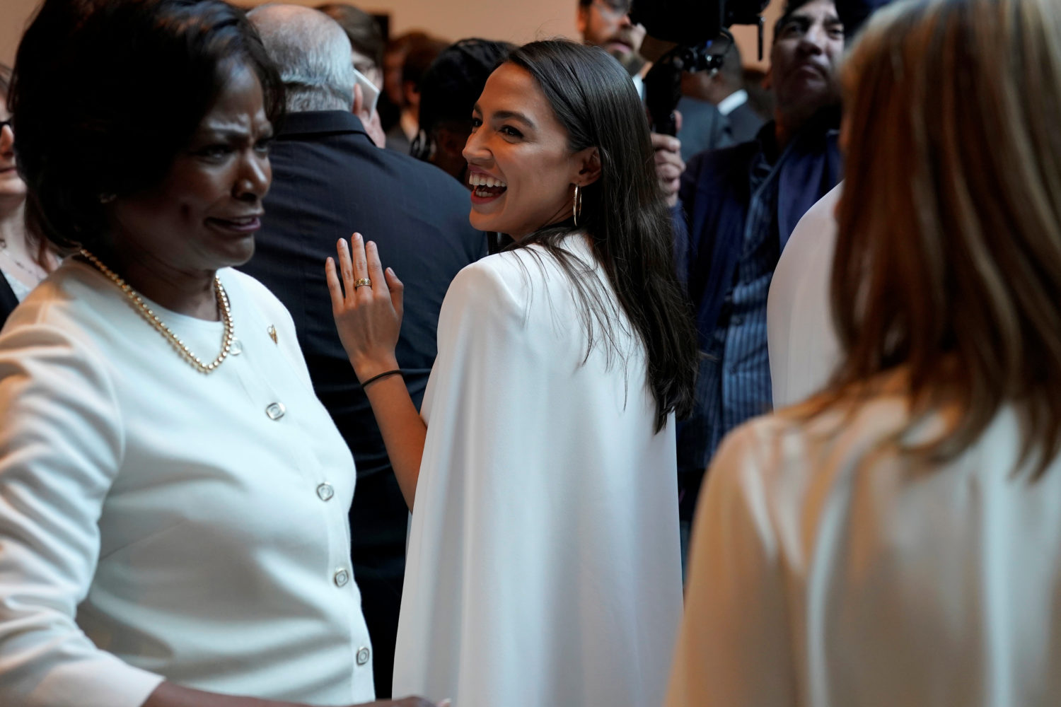 Rep. Alexandria Ocasio Cortez (D-NY) speaks with Democratic women House members during a photo-op recognizing suffragettes before the State of Union address on Capitol Hill in Washington, U.S., February 5, 2019. REUTERS/Joshua Roberts