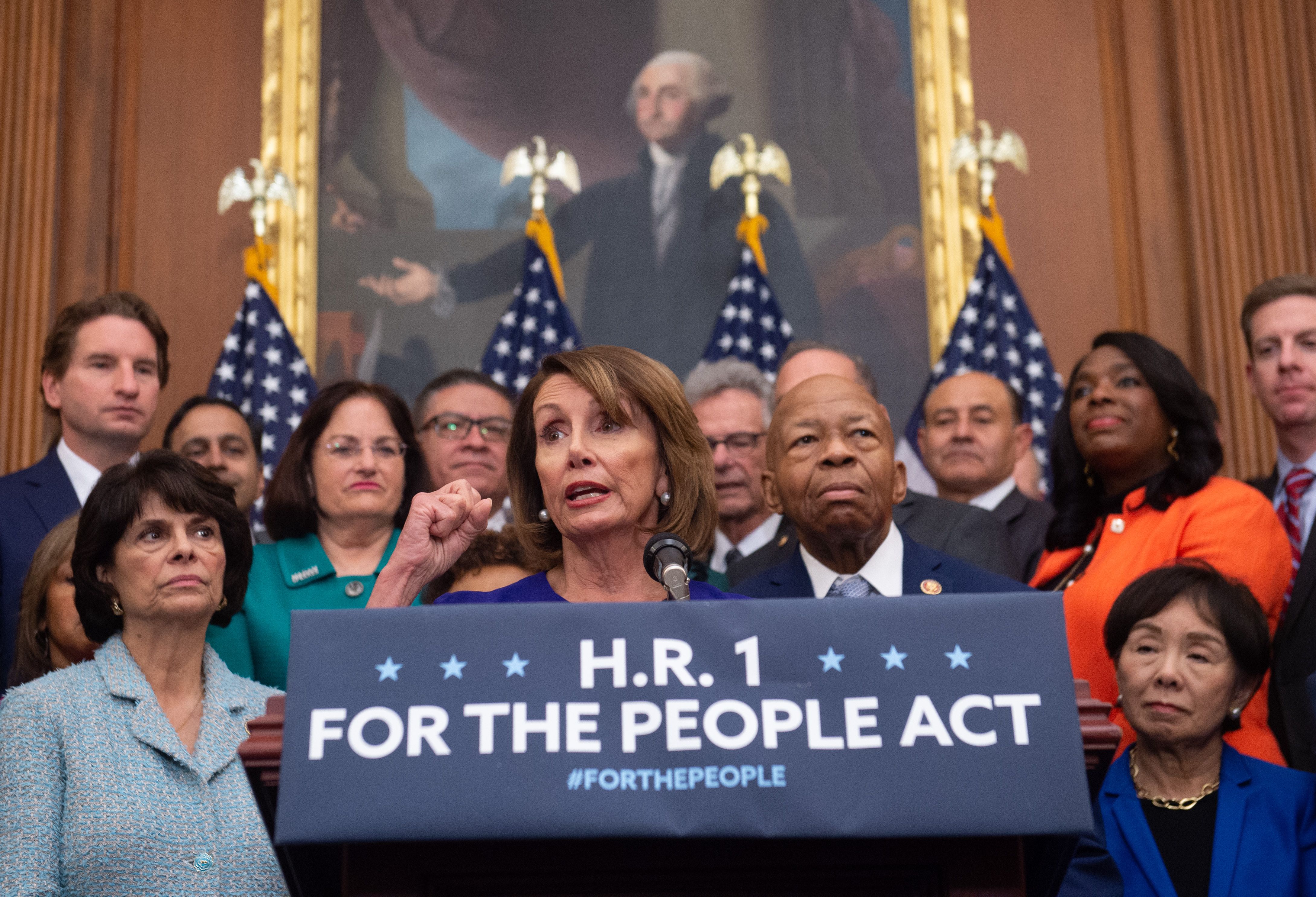 US Speaker of the House Nancy Pelosi (C), Democrat of California, speaks alongside Democratic members of the House about H.R.1, the "For the People Act," at the US Capitol in Washington, DC, January 4, 2019. - Democrats announced their first piece of legislation to reform voting rights provisions, ethics reforms and a requirement that presidential candidates release 10 years of tax returns. (Photo by SAUL LOEB / AFP) (Photo credit should read SAUL LOEB/AFP/Getty Images)