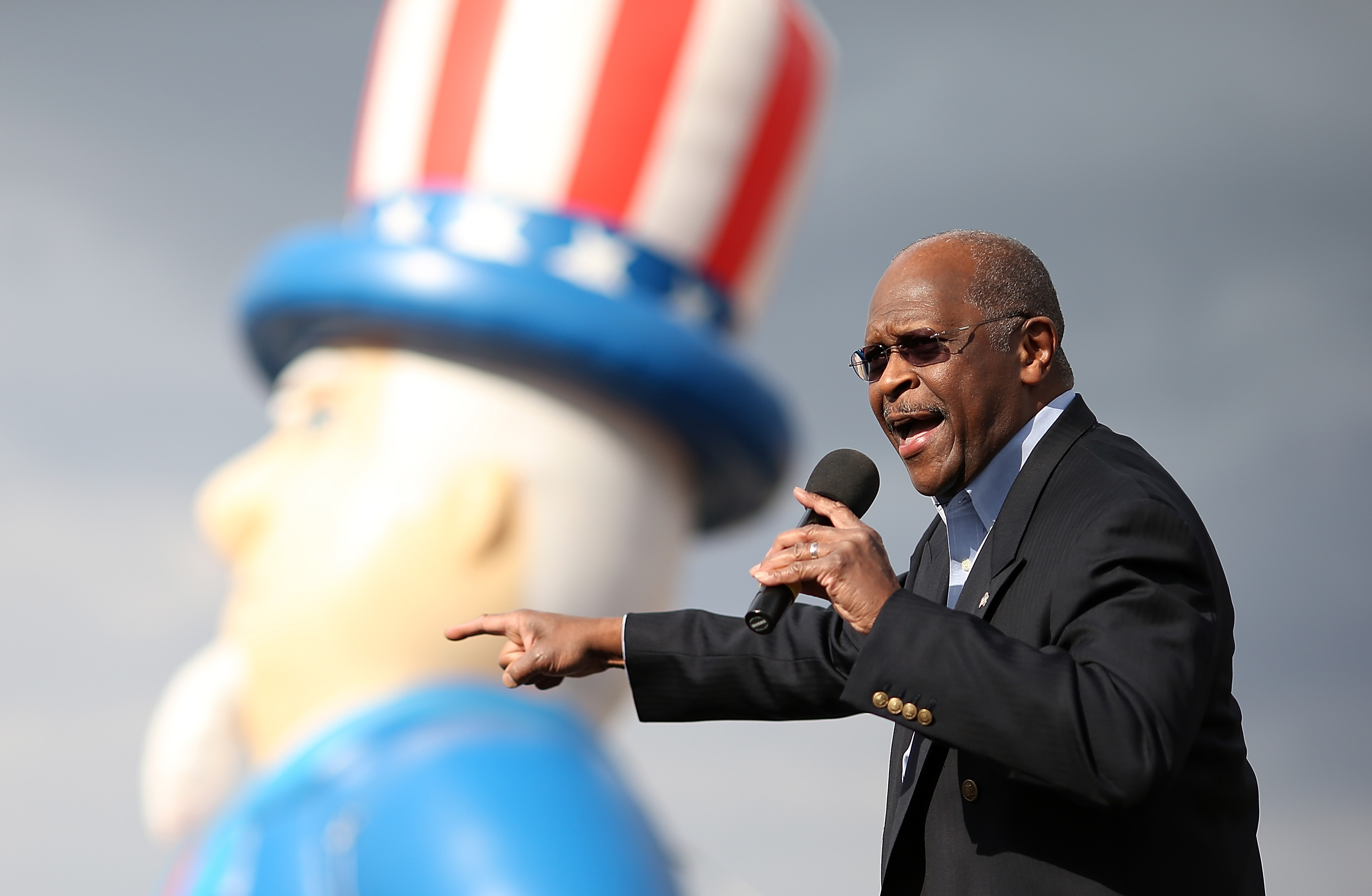 RENO, NV - JULY 23: Former Republican presidential candidate Herman Cain speaks during an American For Prosperity rally on July 23, 2012 in Reno, Nevada. Hundreds of people attended an Americans For Prosperity rally to see former Republican presidential candidate speak. (Photo by Justin Sullivan/Getty Images)