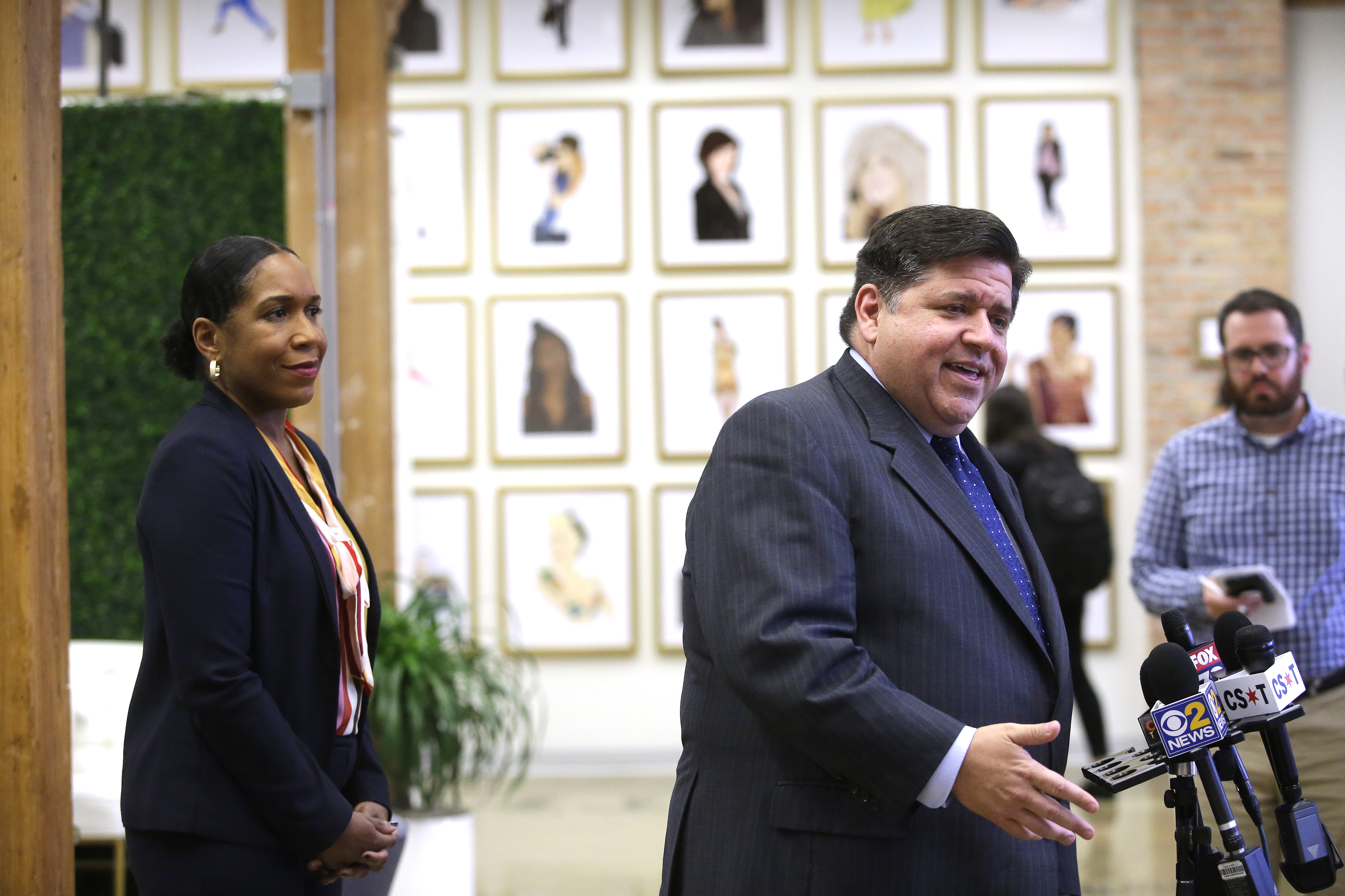 Illinois gubernatorial candidate J.B. Pritzker stands with his Illinois gubernatorial Lieutenant Governor candidate Juliana Stratton as he speaks to reporters after sitting with high school students during a round table discussion at a creative workspace for women on October 1, 2018 in Chicago, Illinois. (Photo by Joshua Lott/Getty Images)