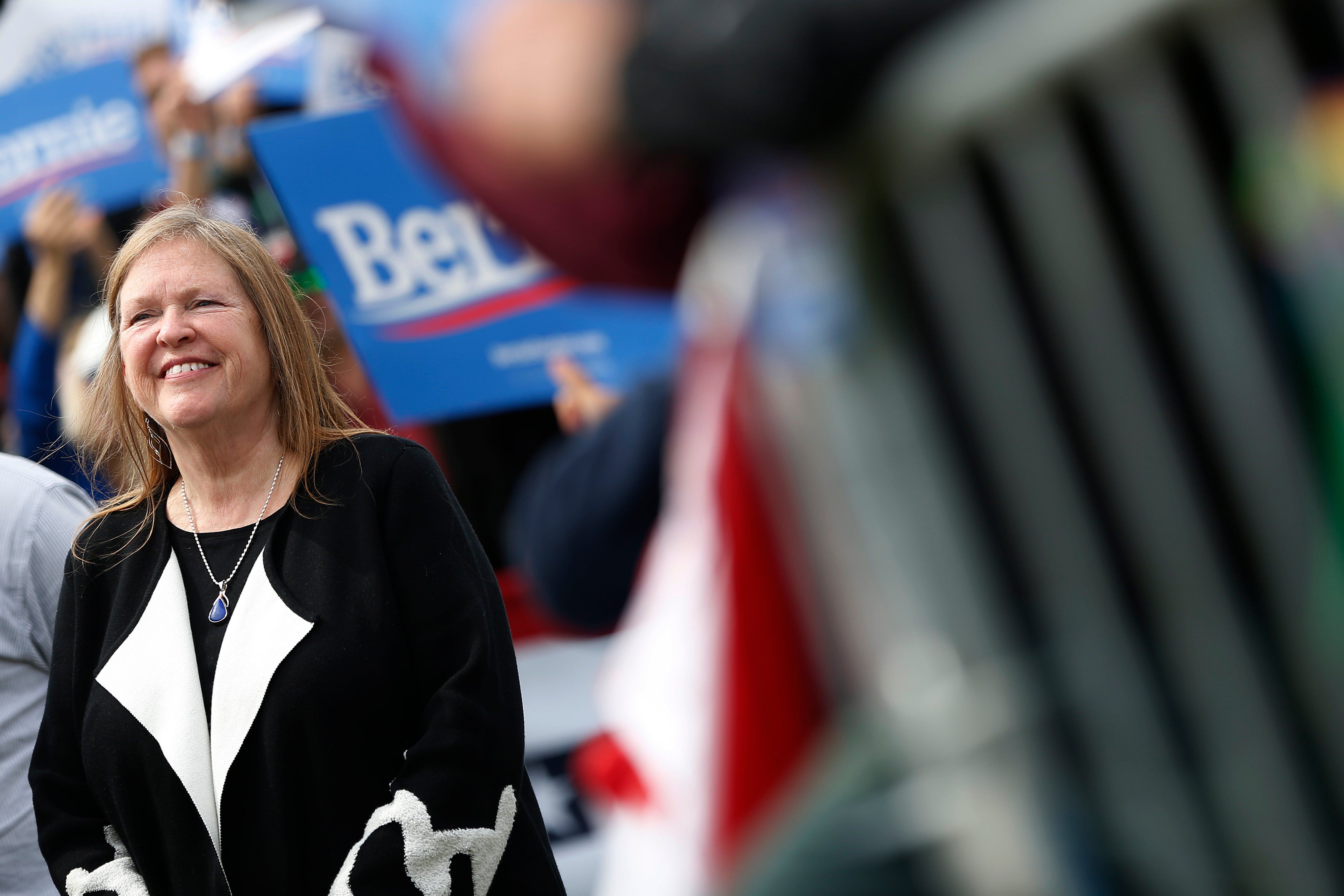 Jane Sanders, wife of 2020 Democratic presidential candidate U.S. Sen. Bernie Sanders smiles as her husband speaks on stage during a campaign rally at Great Meadow Park in Fort Mason on March 24, 2019 in San Francisco, California. (Photo by Stephen Lam/Getty Images)