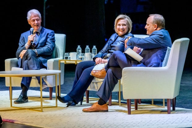 NEW YORK, NEW YORK - APRIL 11: Former President of the United States Bill Clinton with his wife, Former Secretary of State and presidential candidate Hillary Clinton and moderator Paul Begala on Stage during "An Evening With The Clintons" at Beacon Theatre on April 11, 2019 in New York City. (Photo by Roy Rochlin/Getty Images)