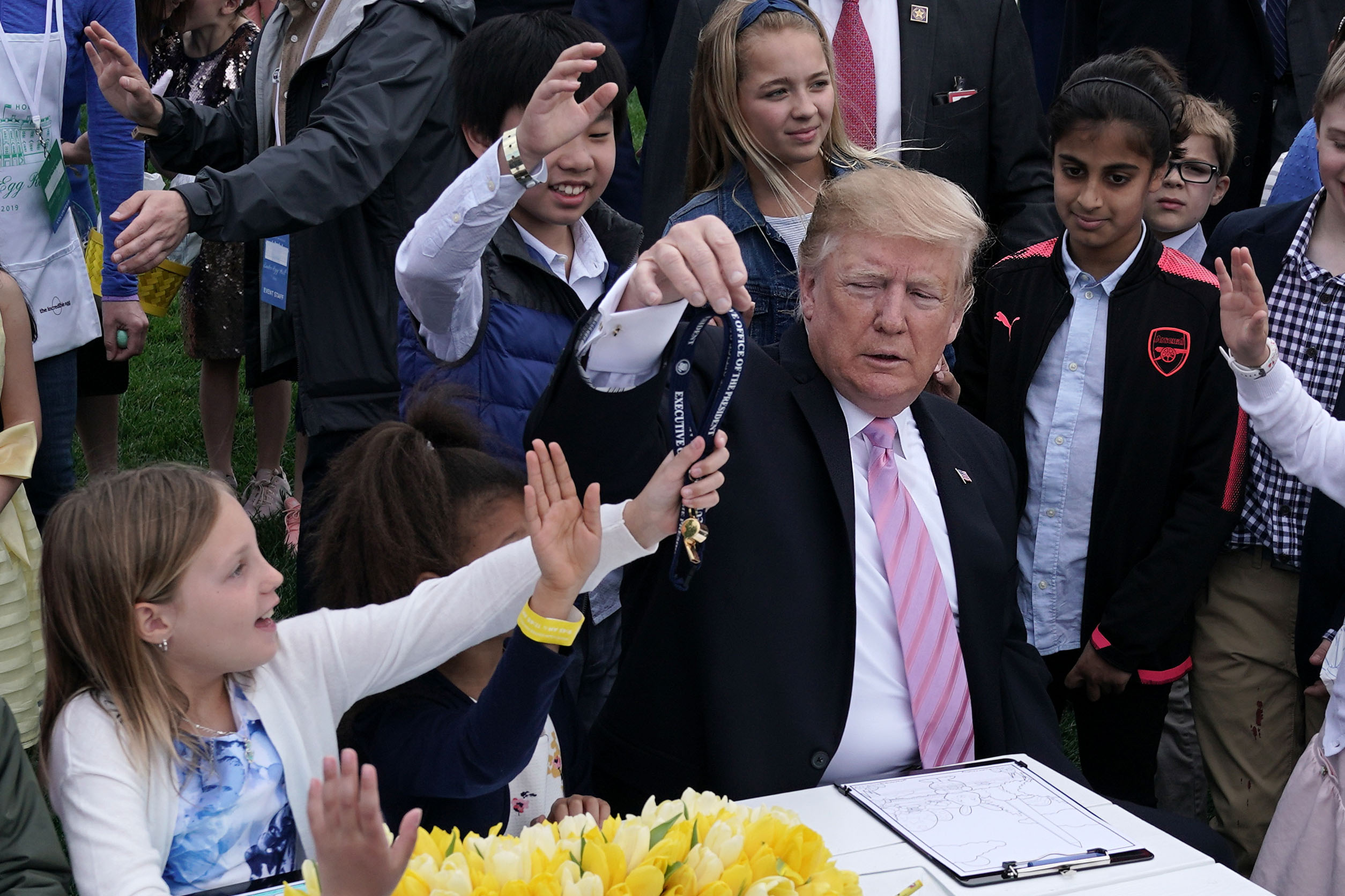 WASHINGTON, DC - APRIL 22: U.S. President Donald Trump hands out the whistle that he blew to children during the 141st Easter Egg Roll on the South Lawn of the White House April 22, 2019 in Washington, DC. About 30,000 people are expected to attend the annual tradition of rolling colored eggs down the South Lawn of the White House that dates back to the Rutherford B. Hayes Administration in 1878. (Photo by Alex Wong/Getty Images)