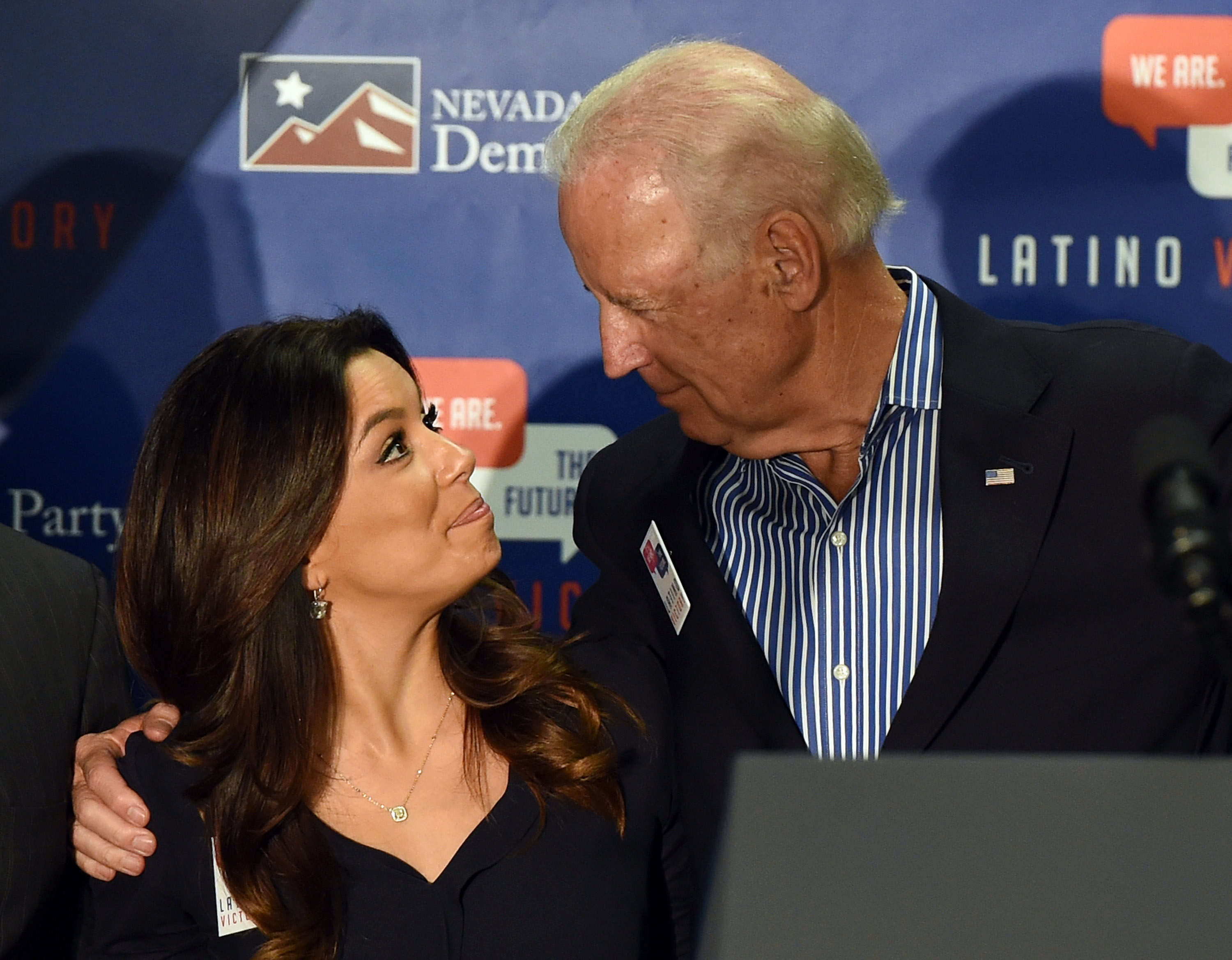Actress Eva Longoria (L), co-founder of the Latino Victory PAC, and U.S. Vice President Joe Biden embrace after speaking at a get-out-the-vote rally at a union hall on November 1, 2014 in Las Vegas, Nevada. (Photo by Ethan Miller/Getty Images)