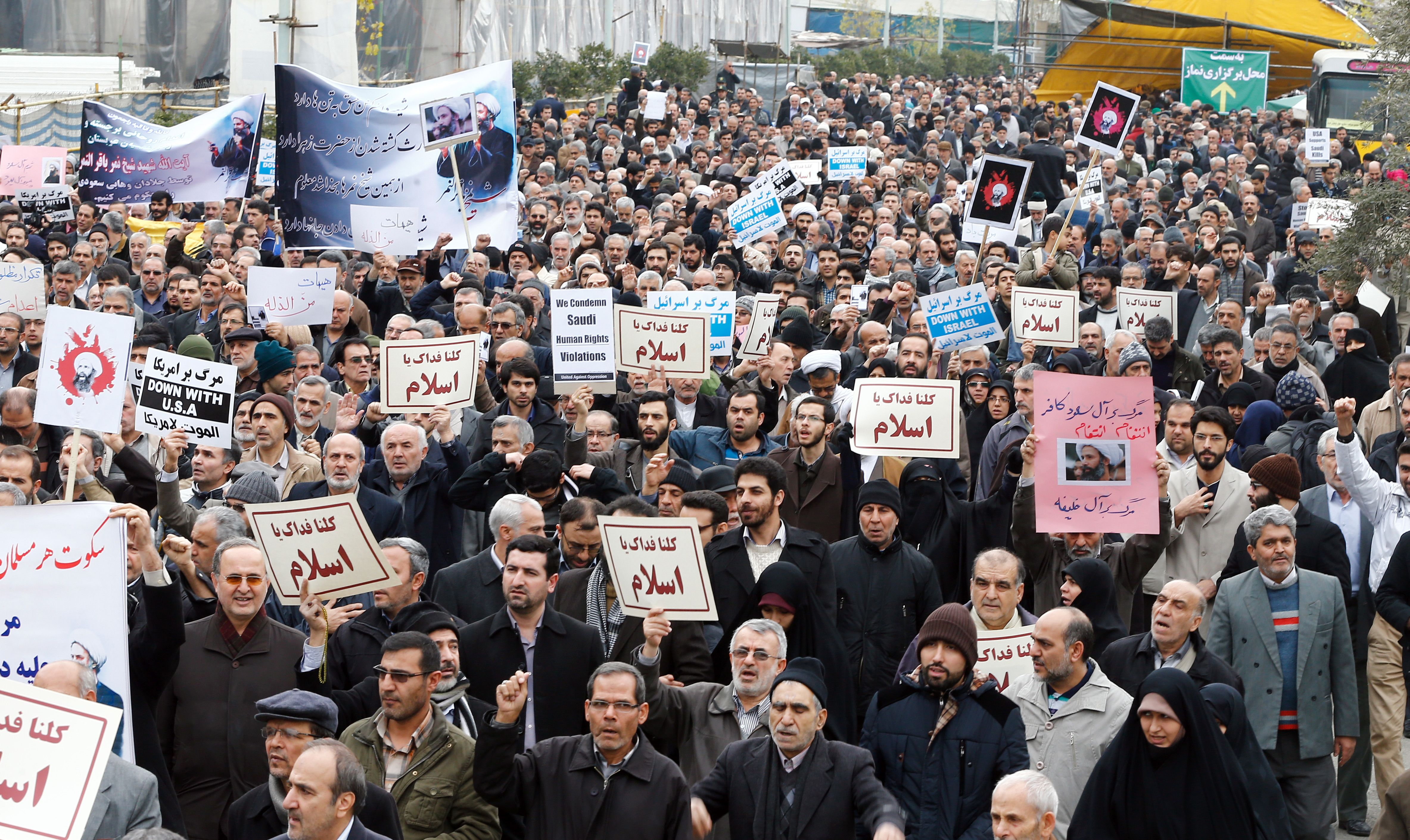 Iranian protesters hold placards and shout slogans during a demonstration in Tehran on January 8, 2016, against the execution of prominent Shiite Muslim cleric Nimr al-Nimr by Saudi authorities. Nimr was executed on January 2, 2016, along with 46 other prisoners that Riyadh said were "terrorists". (AFP/Getty Images)