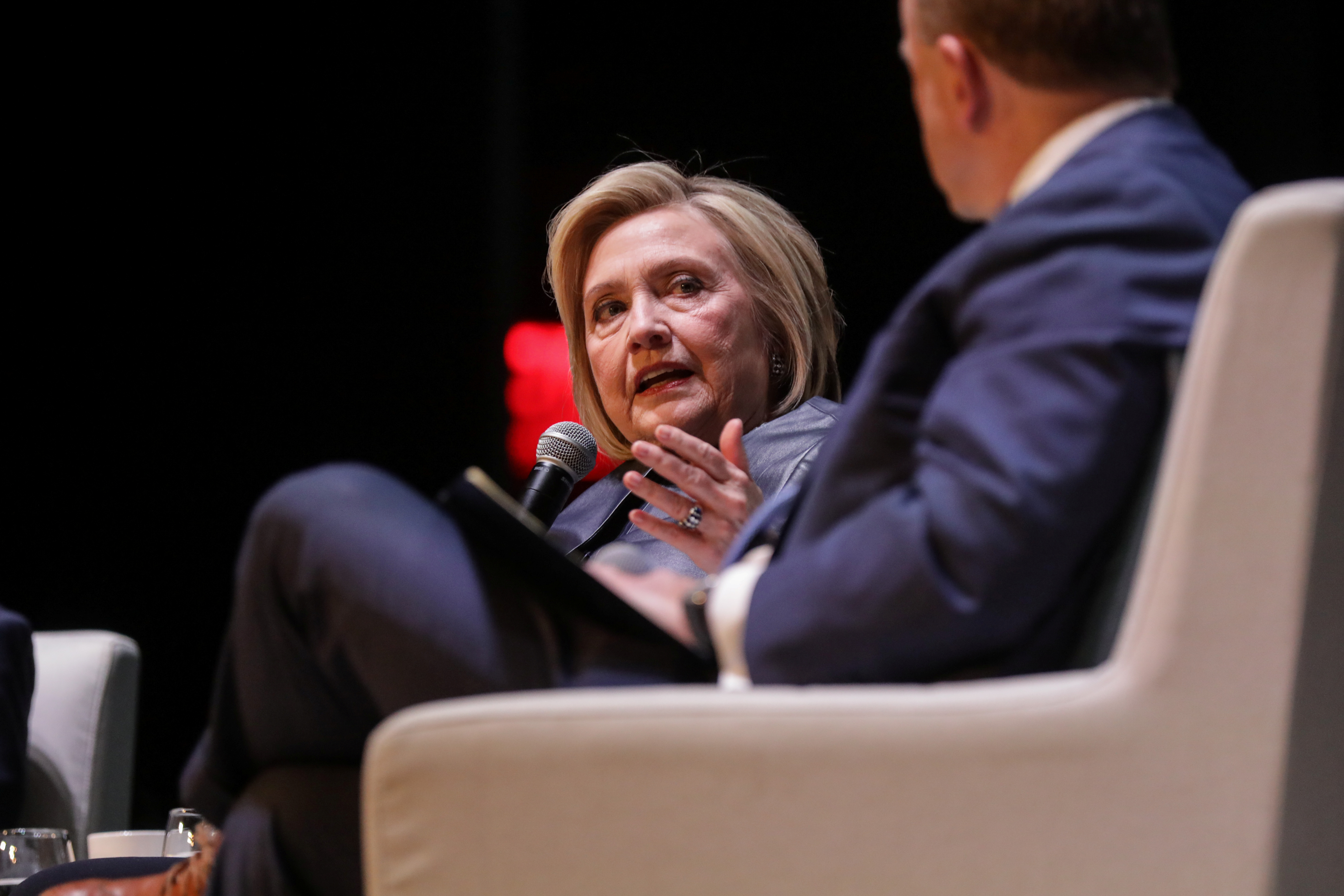 Former Secretary of State Hillary Clinton appears with former President Bill Clinton during a joint on stage conversation event at the Beacon Theatre in New York, U.S., April 11, 2019. REUTERS/Stephen Yang