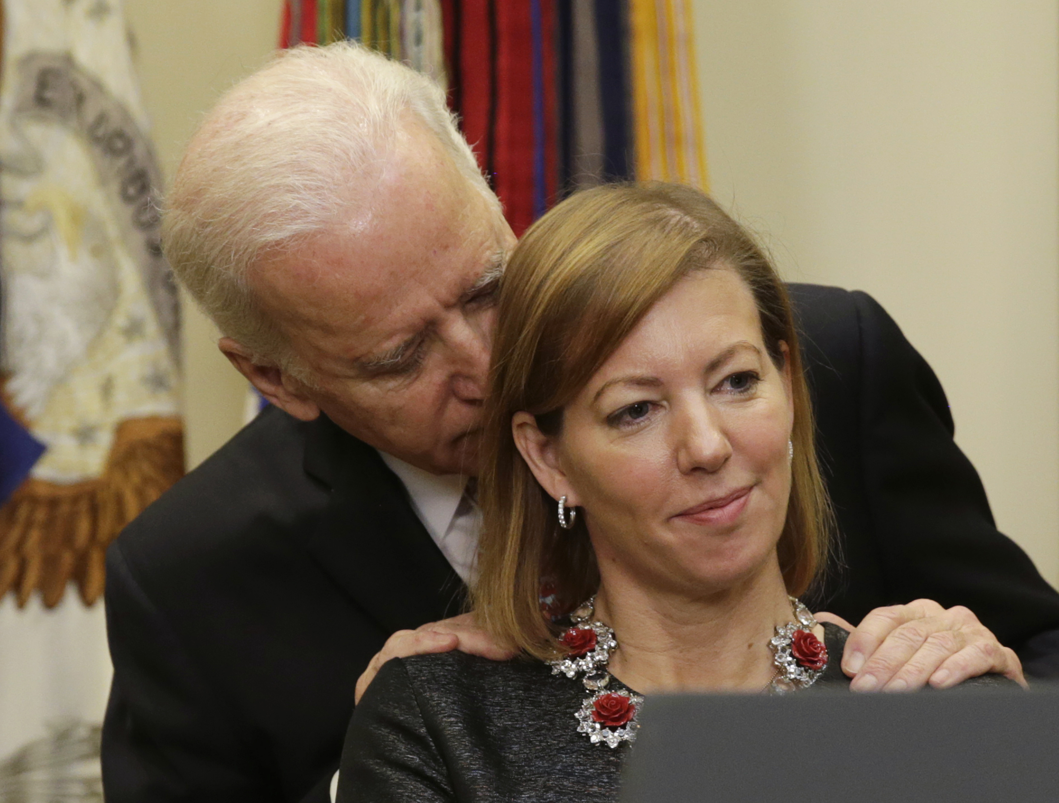 United States Vice President Joe Biden talks to Stephanie Carter (R) as her husband Ash Carter (not pictured) delivers his acceptance speech TPX IMAGES OF THE DAY) - GM1EB2I02FA01