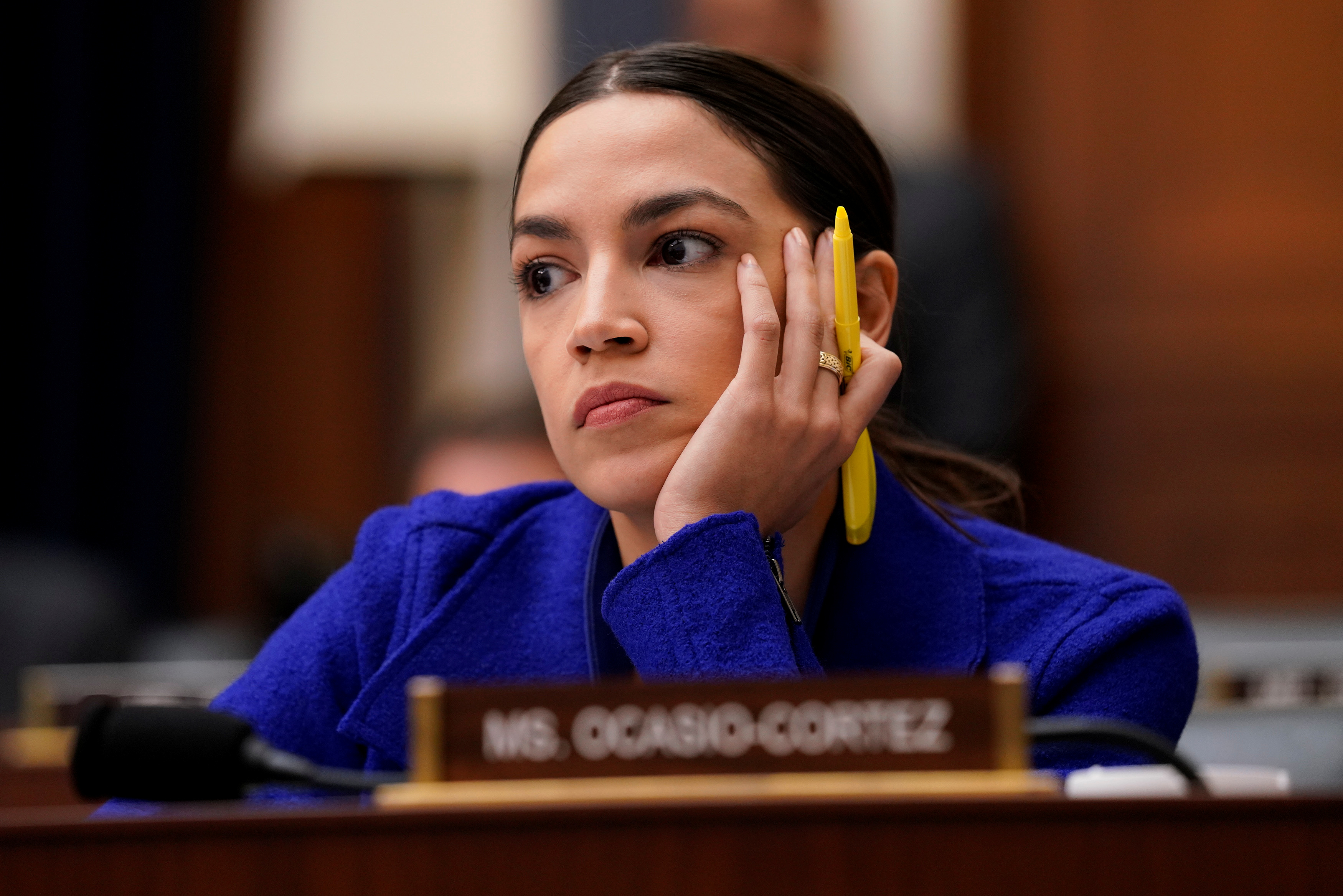 Rep. Alexandria Ocasio-Cortez (D-NY) looks on as bank CEOs testify before a House Financial Services Committee hearing on Capitol Hill in Washington