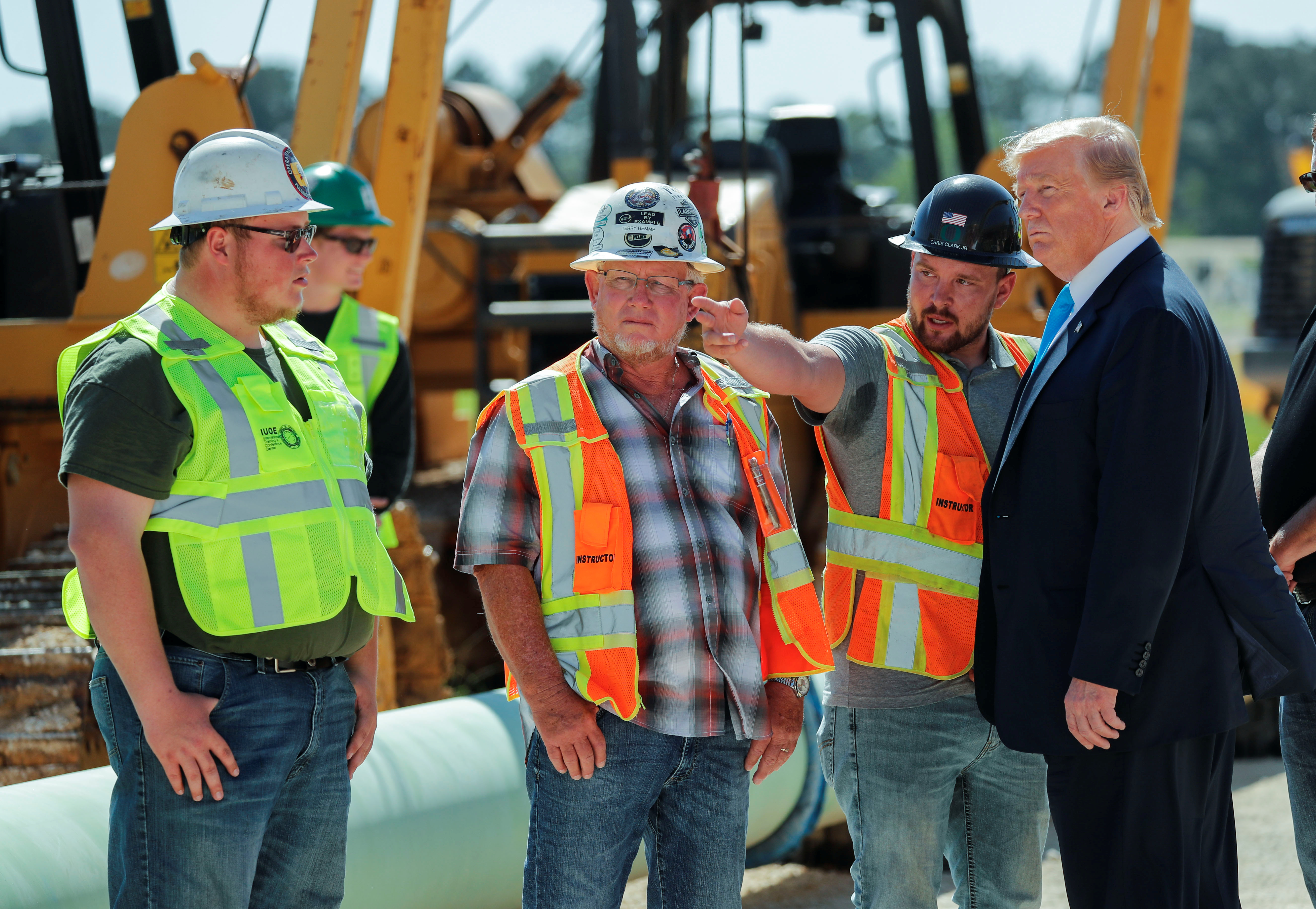 U.S. President Trump talks with workers at the International Union of Operating Engineers International Training and Education Center in Crosby, Texas