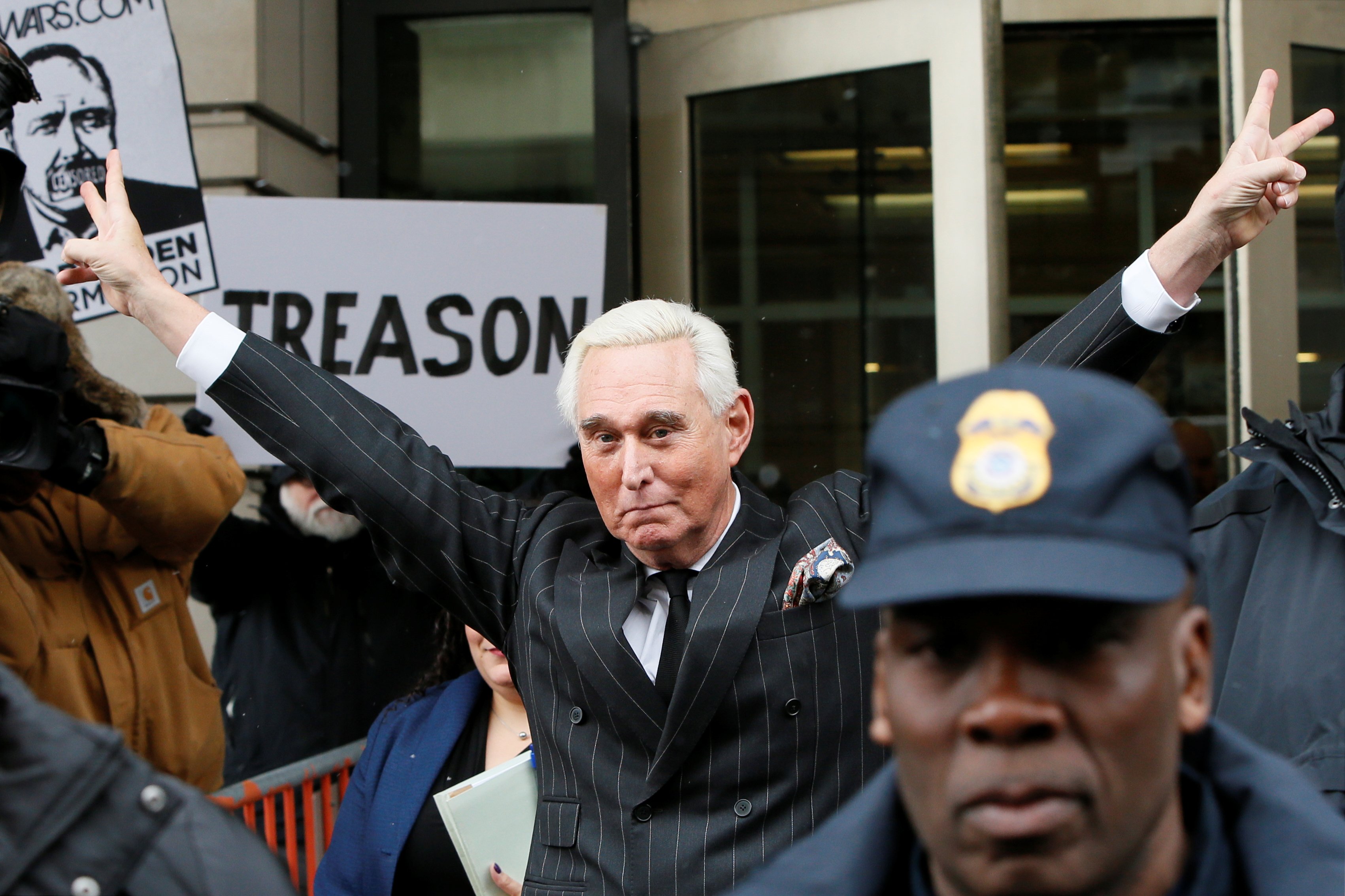 Roger Stone, longtime political ally of U.S. President Donald Trump, flashes a victory gesture as he departs following a status conference in the criminal case against him brought by Special Counsel Robert Mueller at U.S. District Court in Washington, U.S., February 1, 2019. REUTERS/Jim Bourg