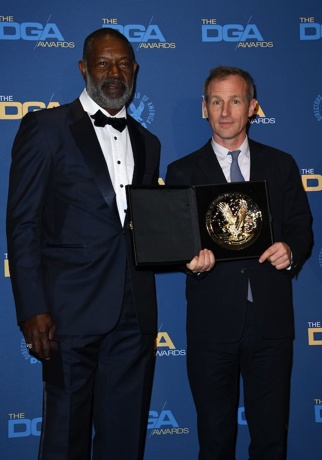 Director Spike Jonze poses next to actor Dennis Haysbert with the award for Outstanding Directorial Achievement in Commercials for 