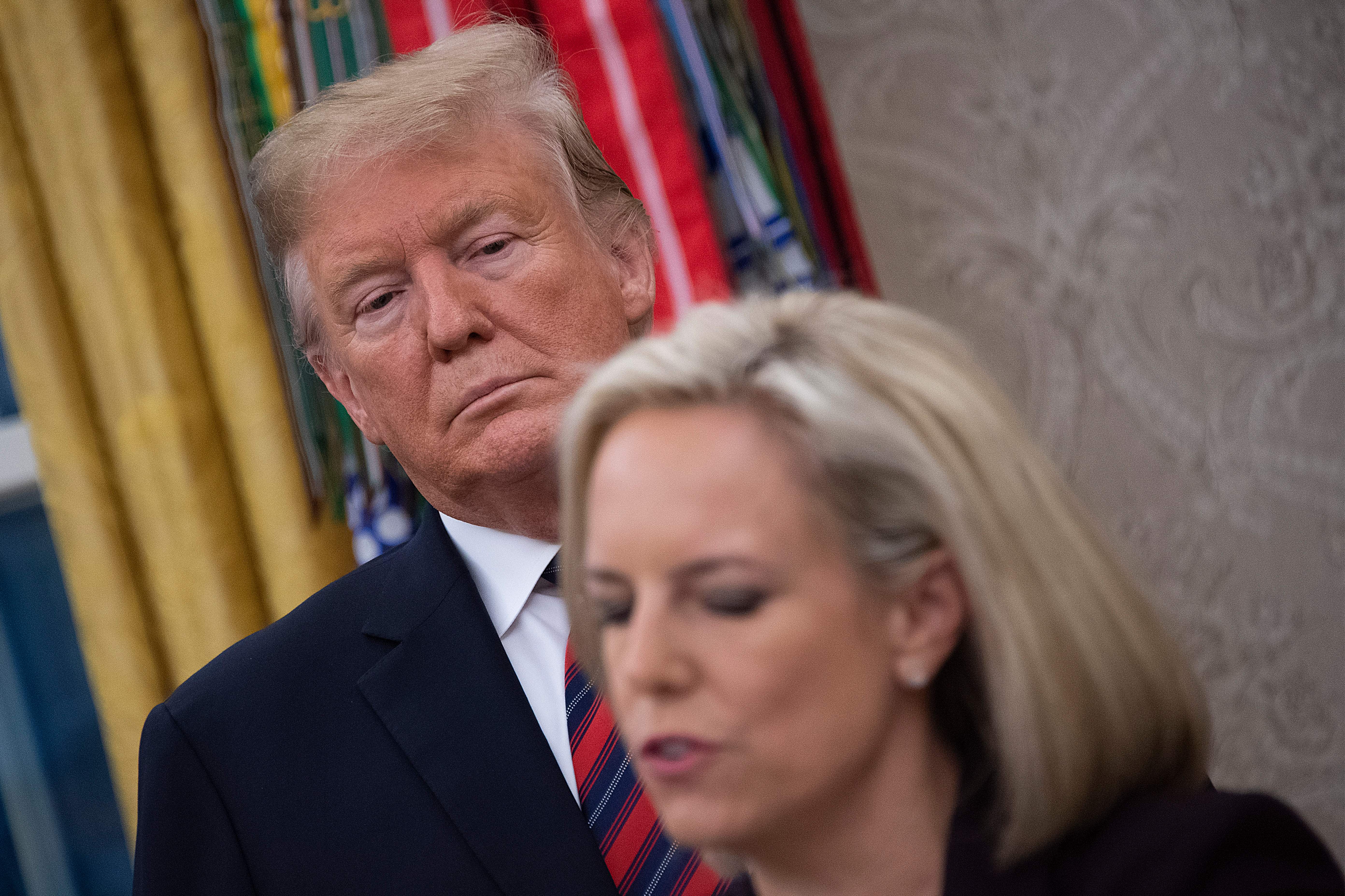 US President Donald Trump (L) and US Secretary of Homeland Security Kirstjen Nielsen (R) participate in a Naturalization Ceremony in the Oval Office of the White House in Washington, DC, on January 19, 2019. (Photo: JIM WATSON/AFP/Getty Images)