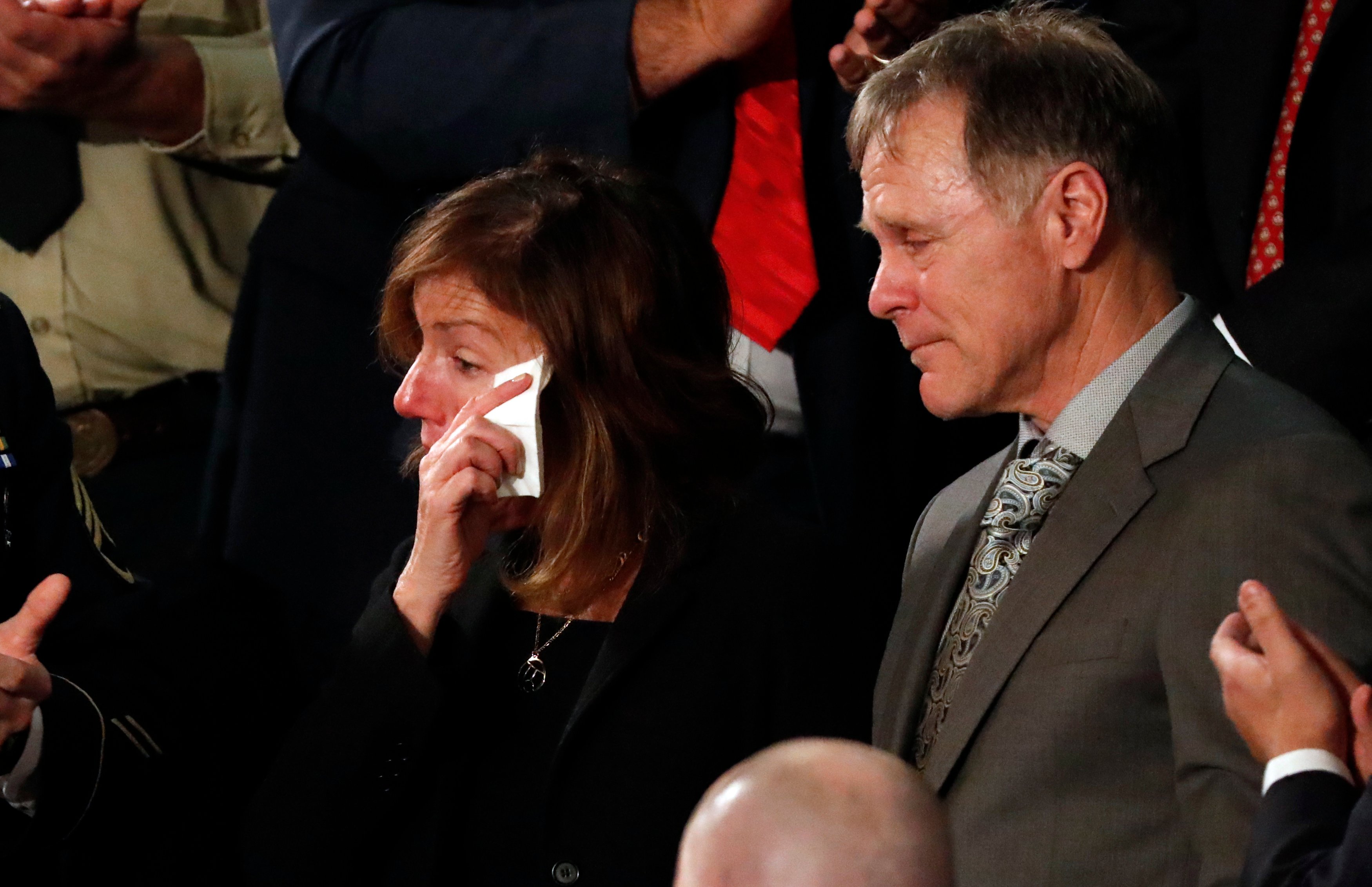 American student Otto Warmbier's parents Fred and Cindy Warmbier cry as U.S. President Donald Trump talks about the death of their son after his arrest in North Korea during the State of the Union address to a joint session of the U.S. Congress on Capitol Hill in Washington, U.S. January 30, 2018. REUTERS/Leah Millis 