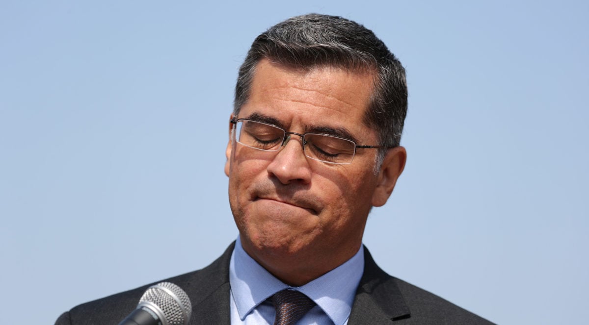 California Attorney General Xavier Becerra speaks about President Trump's proposal to weaken national greenhouse gas emission and fuel efficiency regulations, at a media conference in Los Angeles, California, Aug. 2, 2018. REUTERS/Lucy Nicholson