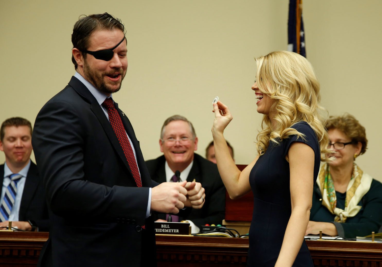 Representative-elect Dan Crenshaw (R-TX) looks as his wife Tara draws 59 during a lottery for office assignments on Capitol Hill in Washington, U.S., November 30, 2018. REUTERS/Joshua Roberts