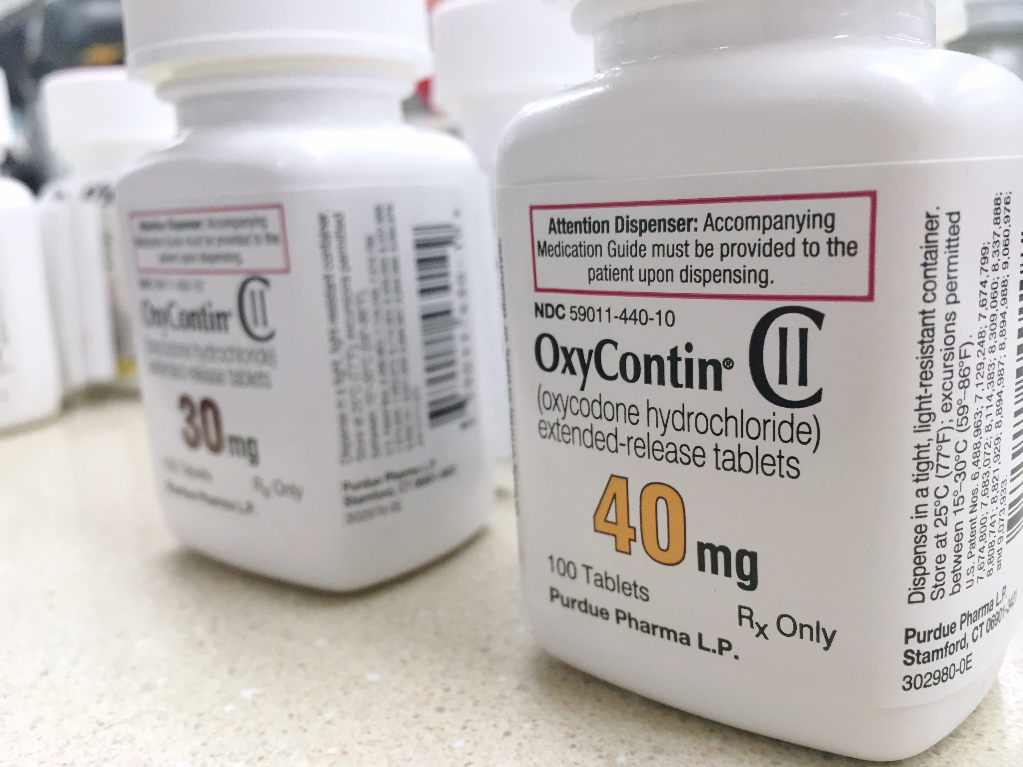 Bottles of OxyContin sit on a counter. Shutterstock image via PureRadiancePhoto