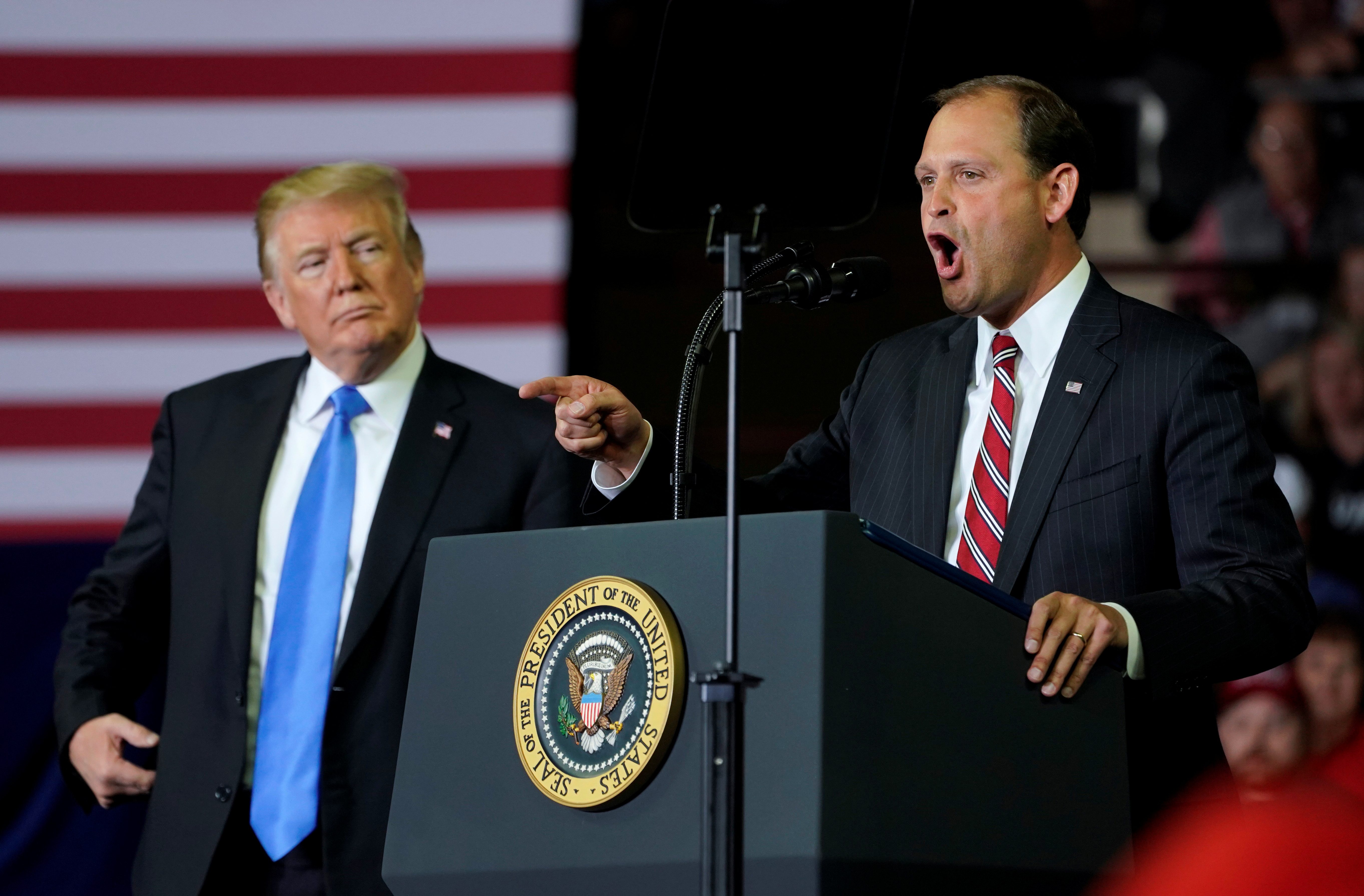 GOP Rep. Andy Barr of Kentucky speaks as U.S. President Donald Trump listens during a Make America Great Again rally in Richmond, Kentucky, U.S., October 13, 2018. REUTERS/Joshua Roberts