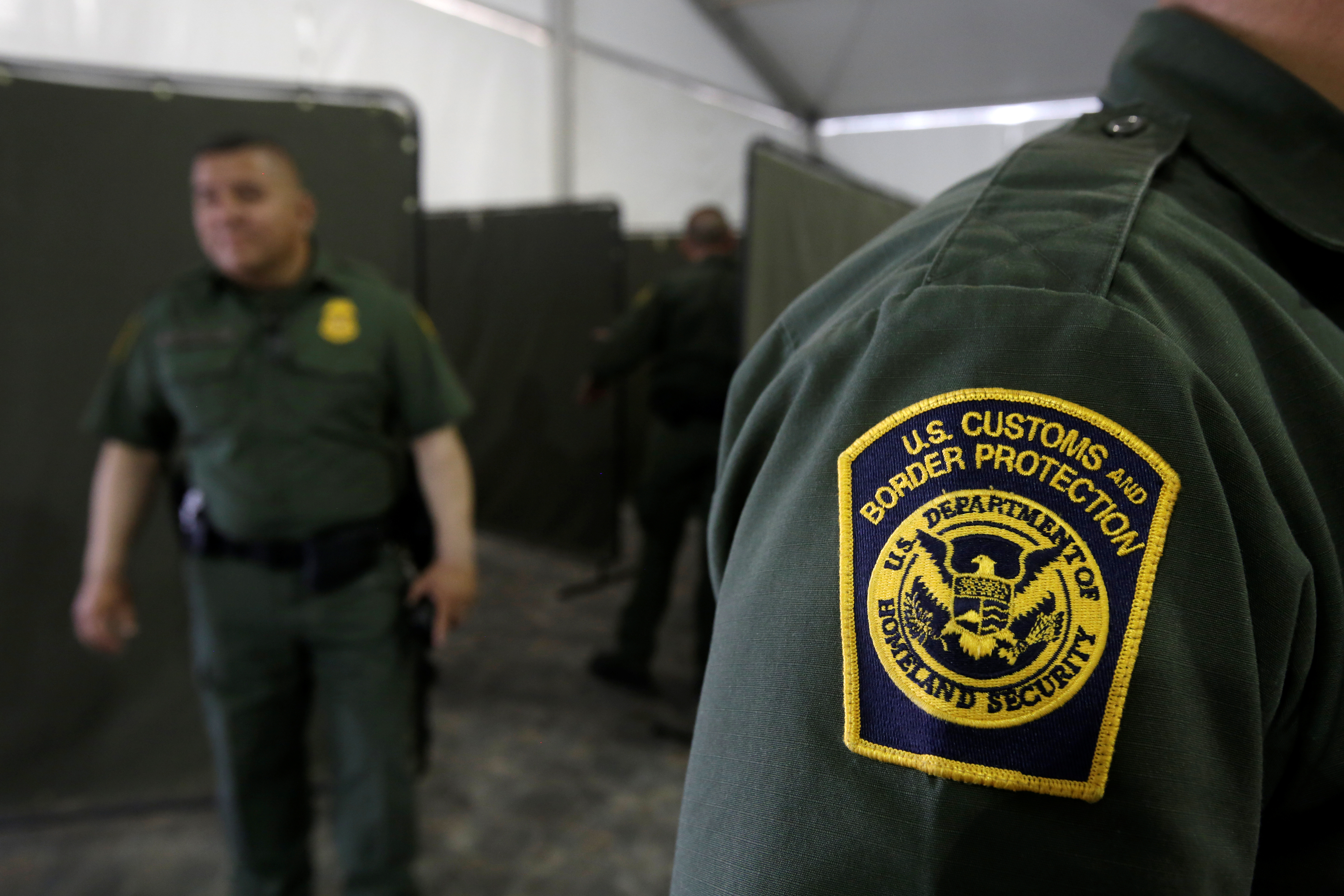 U.S. Border Patrol agents are seen during a tour of U.S. Customs and Border Protection (CBP) temporary holding facilities in El Paso