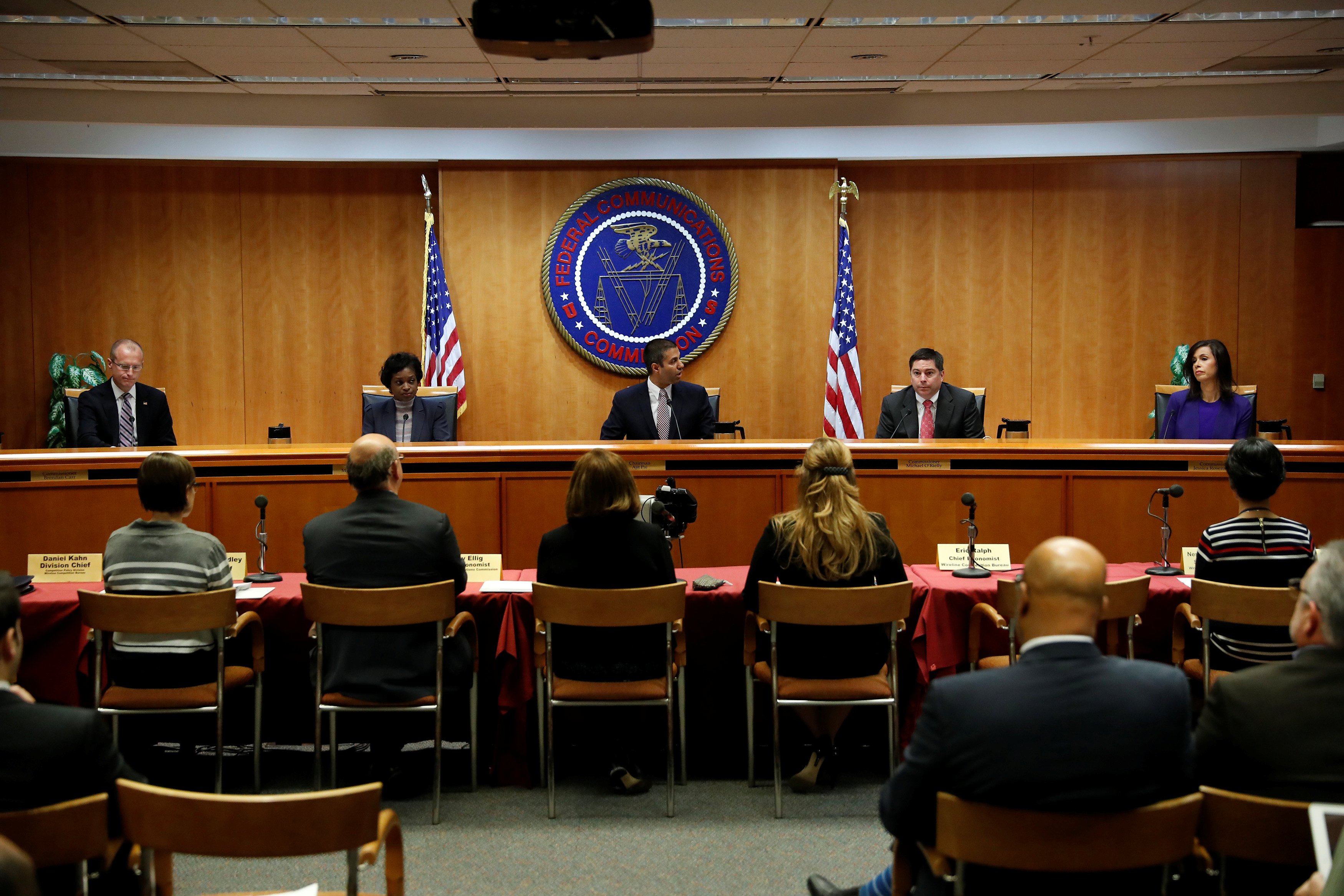 Chairman Ajit Pai (C) leads a vote on the repeal of so called net neutrality rules at the Federal Communications Commission in Washington, U.S., December 14, 2017. REUTERS/Aaron P. Bernstein