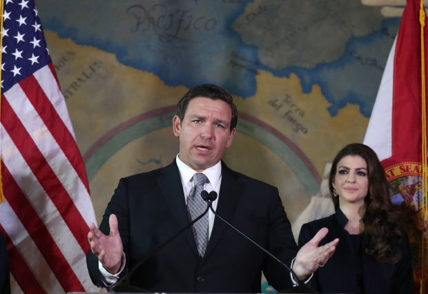 MIAMI, FLORIDA - JANUARY 09: Newly sworn-in Gov. Ron DeSantis speaks, as his wife Casey DeSantis stands near him, during an event at the Freedom Tower where he named Barbara Lagoa to the Florida Supreme Court on January 09, 2019 in Miami, Florida. Mr. DeSantis was sworn in yesterday as the 46th governor of the state of Florida.(Photo by Joe Raedle/Getty Images,)
