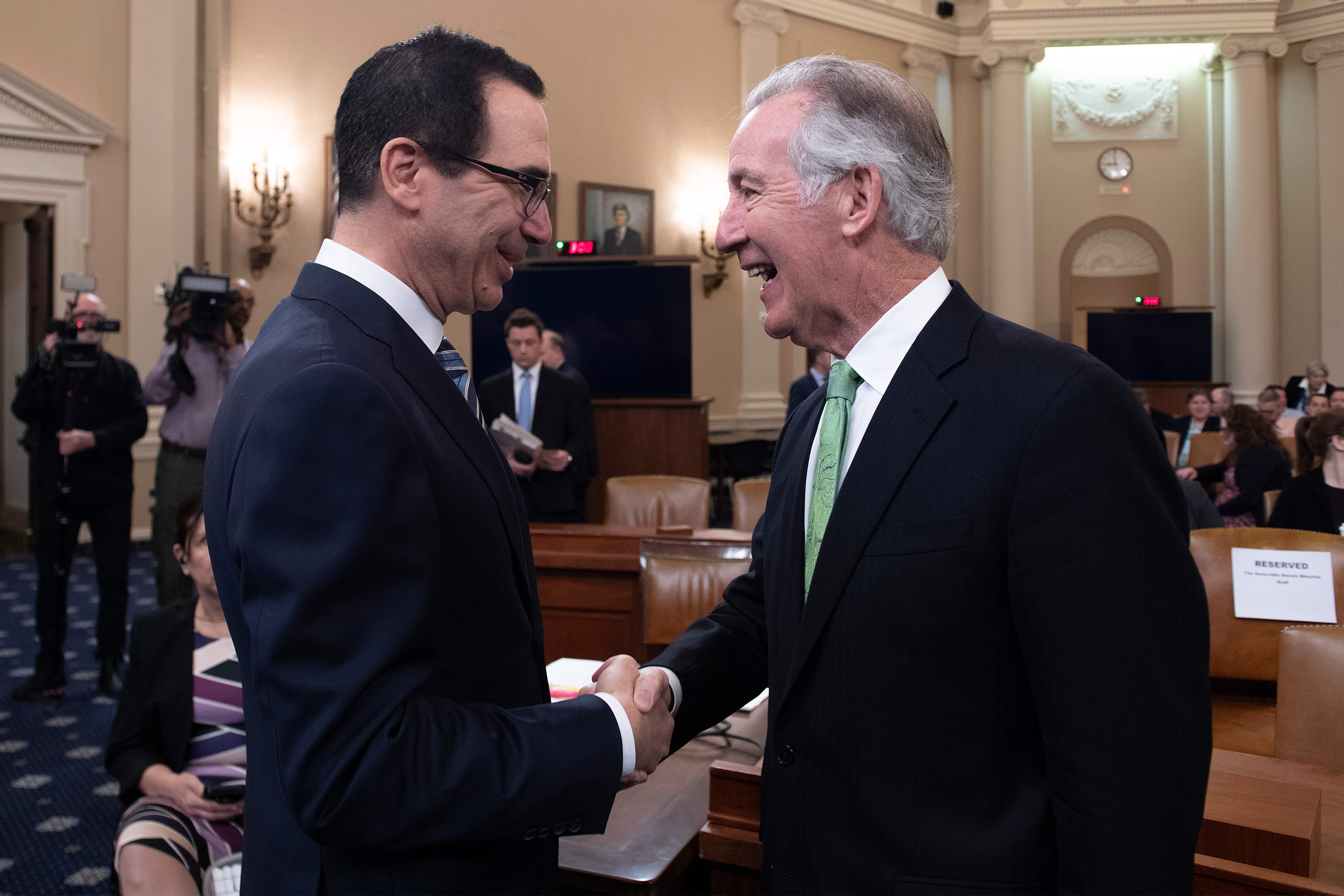 US Treasury Secretary Steven Mnuchin (L) shakes hands with Chairman of the House Ways and Means Committee, Richard Neal, prior to testifying on "The President's FY2020 Budget Proposal" before the House Ways and Means Committee on Capitol Hill in Washington, DC, on March 14, 2019. (JIM WATSON/AFP/Getty Images)